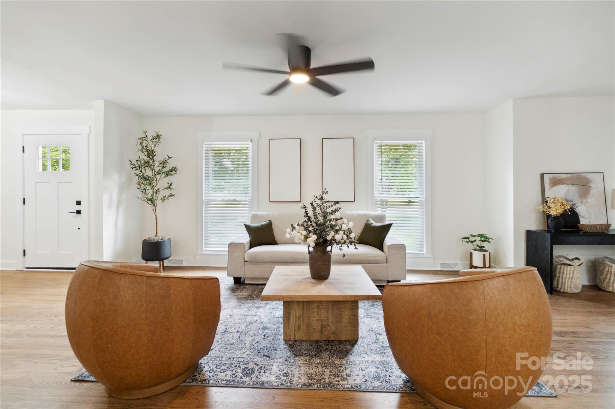 3801 Rea Road Charlotte, NC 28226 - Photo 9 of 47 a living room with furniture a large window and a chandelier