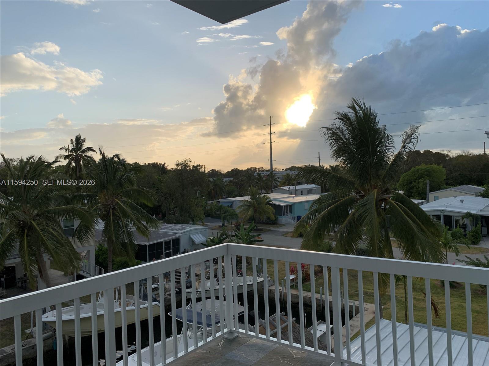 84 Coral Way Key Largo, FL 33037 - Photo 26 of 55 Sunset view from North wrap around balcony. Top floor.