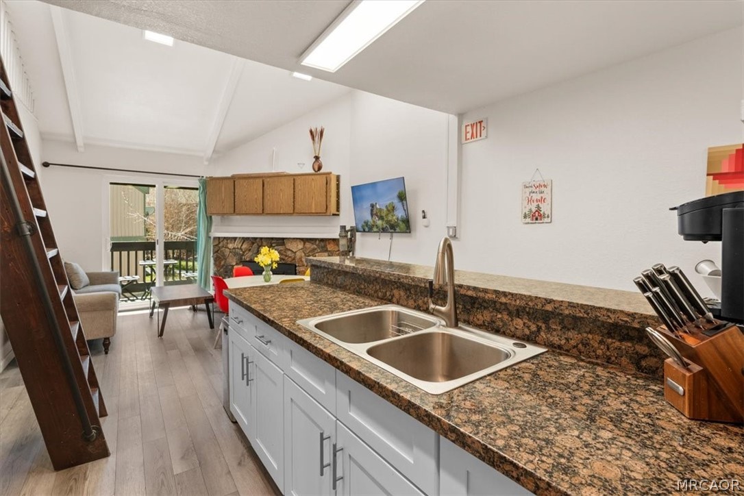760 Blue Jay Road, Unit 26 Big Bear Lake, CA 92315 - Photo 12 of 35 a kitchen with a sink and a stove top oven