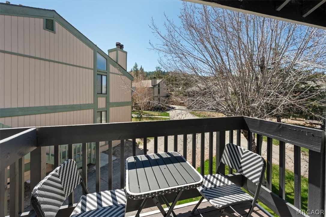 760 Blue Jay Road, Unit 26 Big Bear Lake, CA 92315 - Photo 24 of 35 a view of a balcony with wooden floor