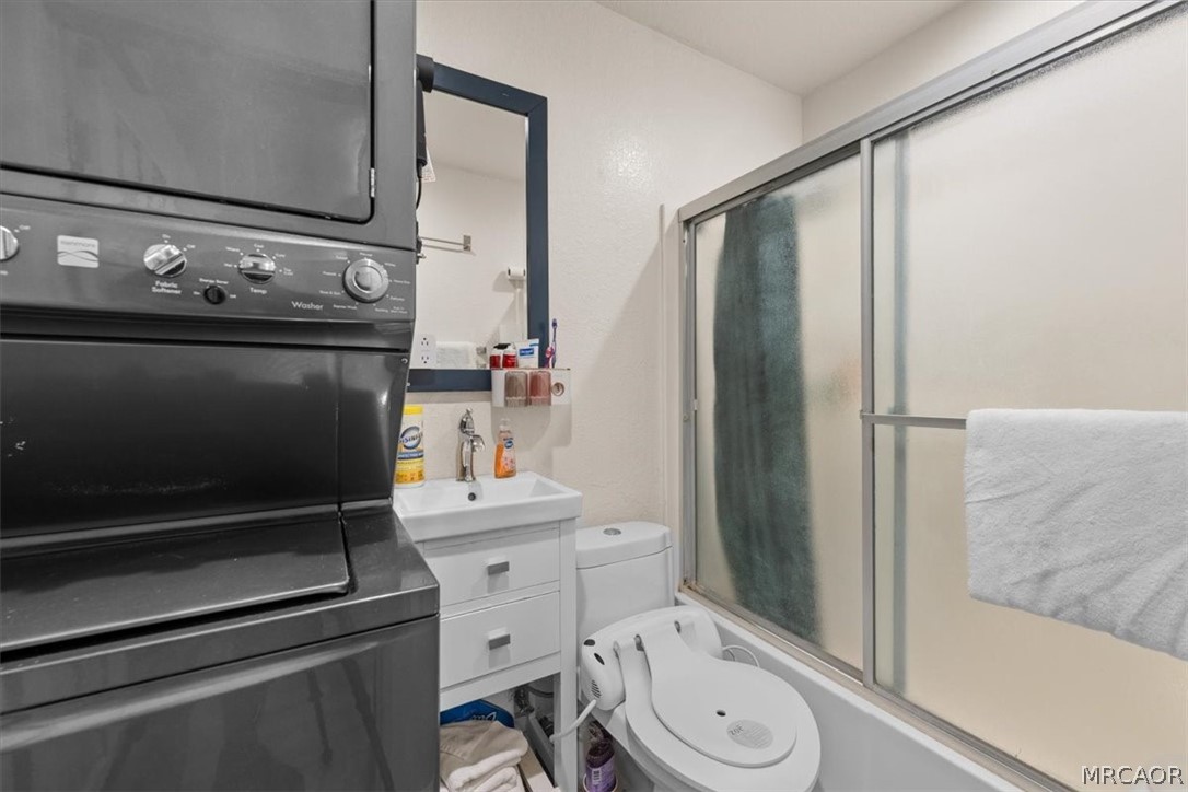 760 Blue Jay Road, Unit 26 Big Bear Lake, CA 92315 - Photo 29 of 35 a bathroom with a granite countertop sink toilet and shower