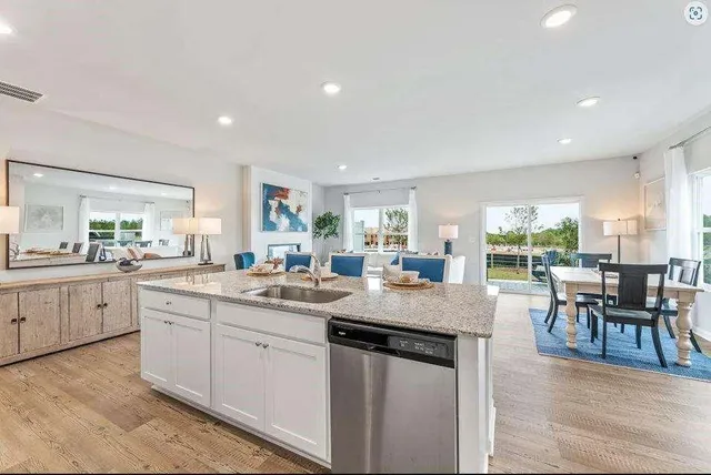 a kitchen with sink and cabinets