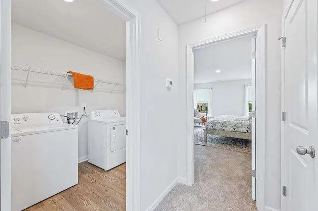 a view of walk in closet and bedroom
