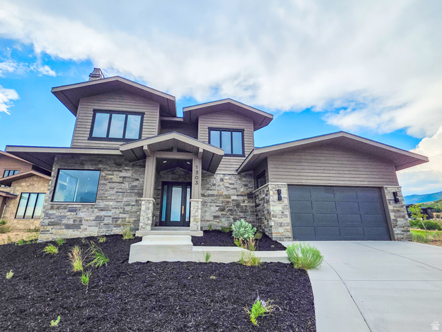Modern architectural design with stacked stone and horizontal siding