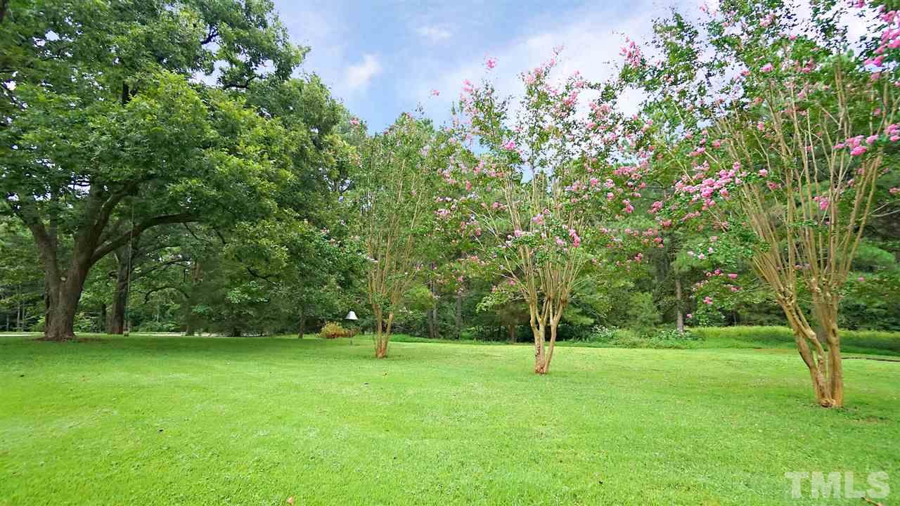 15109 Possum Track Road Raleigh, NC 27614 - Photo 14 of 27 a view of outdoor space with deck and yard