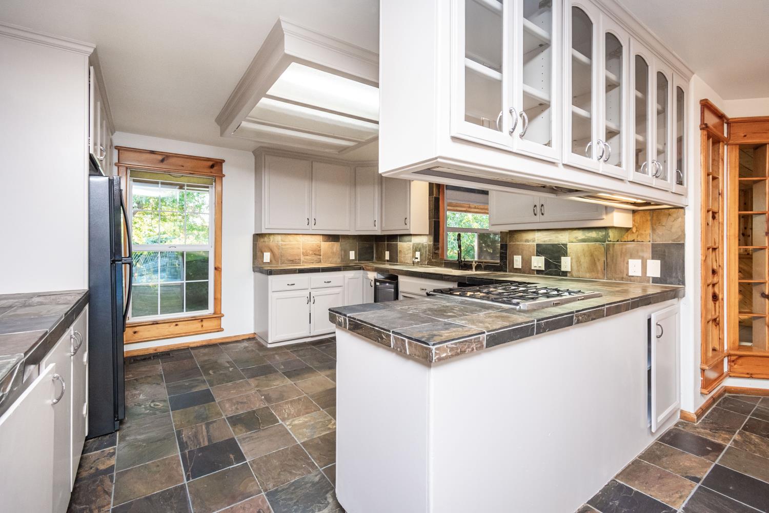 664 Perkins Road Arbuckle, CA 95912 - Photo 17 of 91 a kitchen with a stove a sink and a refrigerator