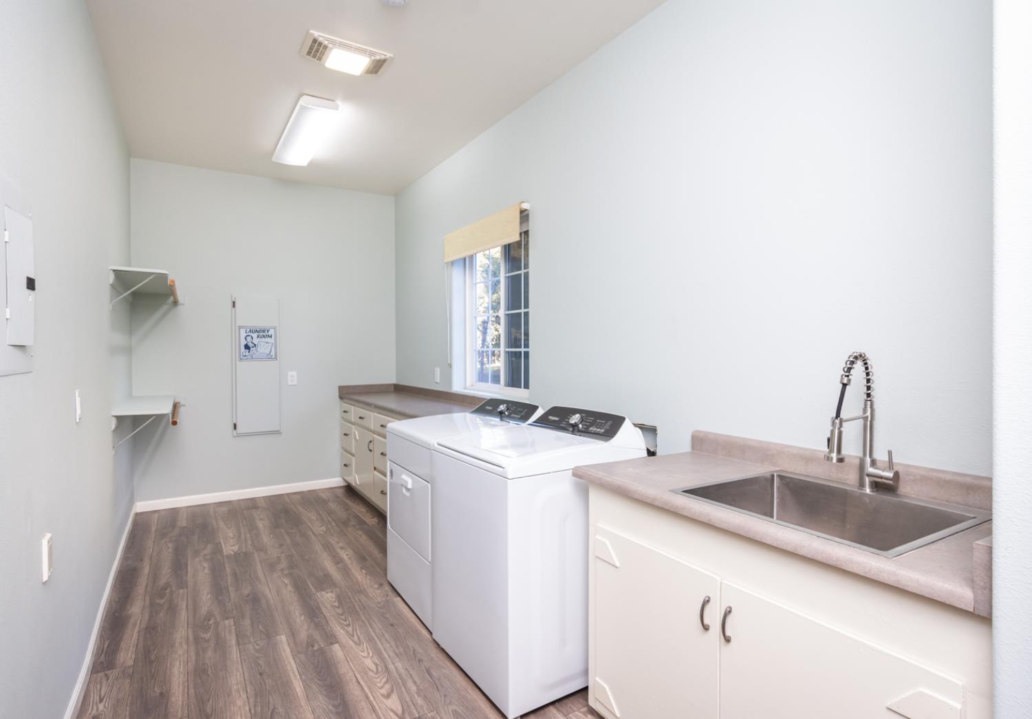 664 Perkins Road Arbuckle, CA 95912 - Photo 29 of 91 a kitchen that has a sink and a stove with white countertops