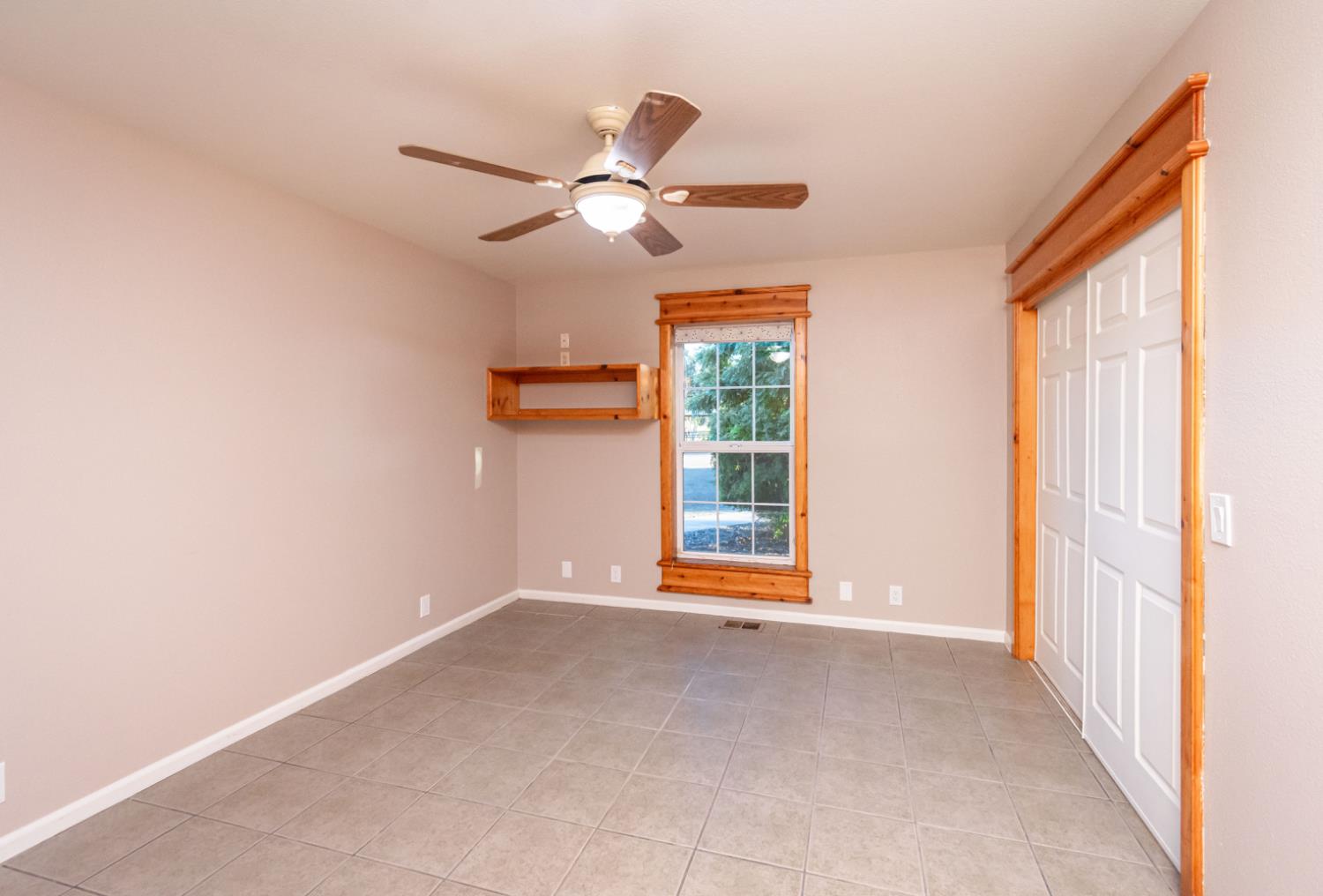 664 Perkins Road Arbuckle, CA 95912 - Photo 36 of 91 a view of empty room with wooden floor and fan