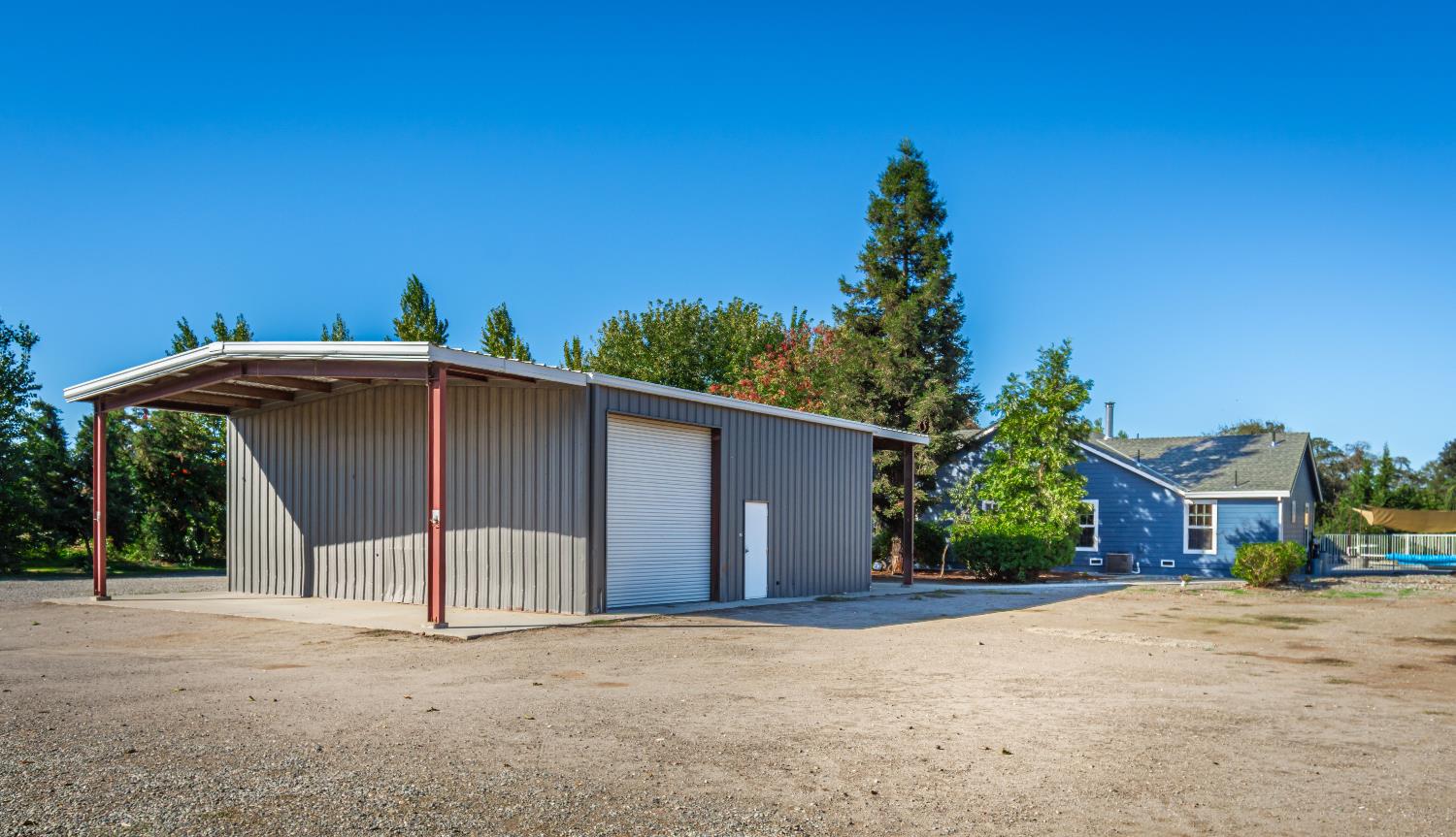 664 Perkins Road Arbuckle, CA 95912 - Photo 48 of 91 a view of a house with a yard and a garage