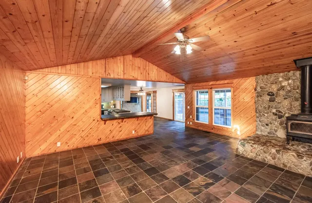 a kitchen with a stove a sink and a refrigerator