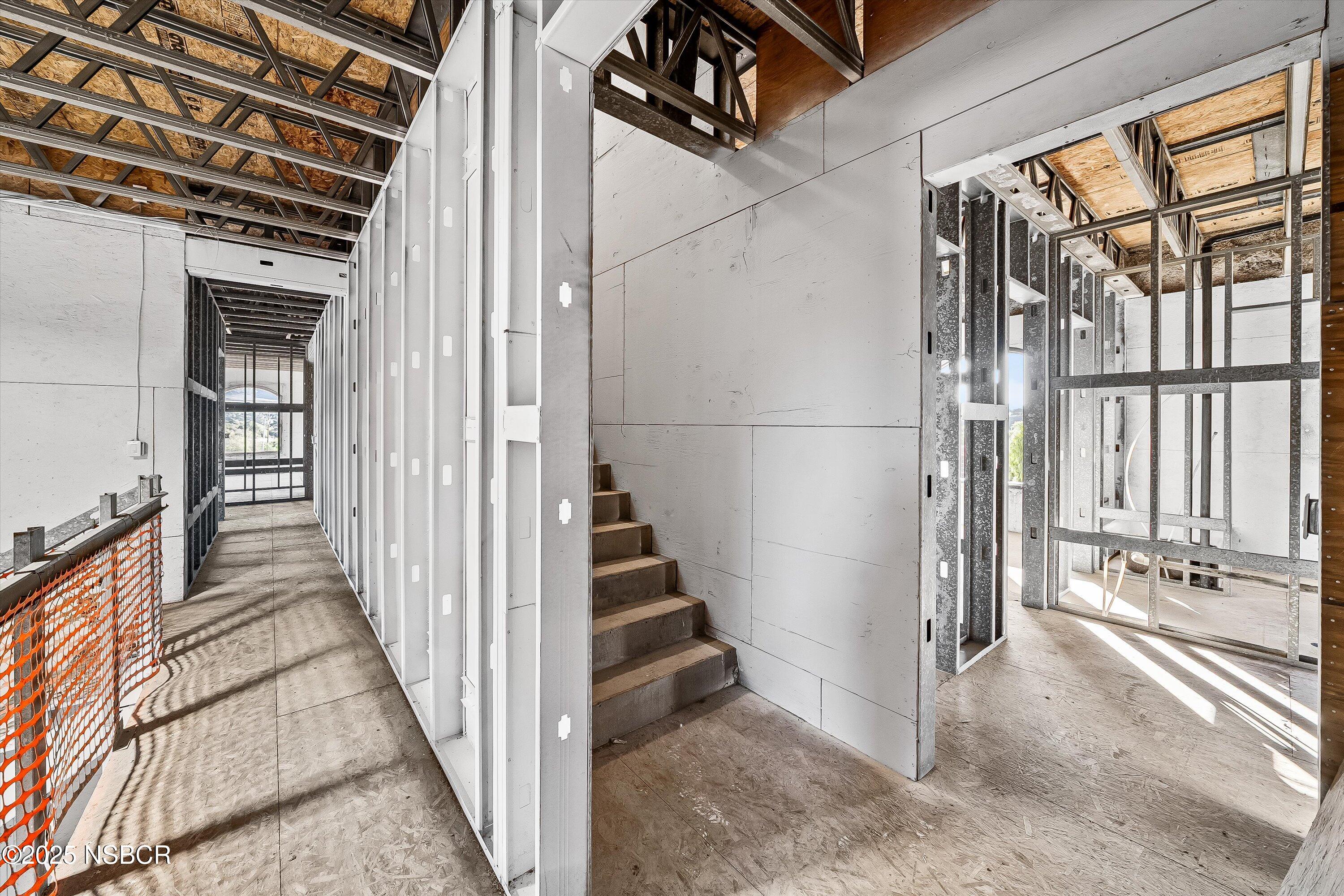 4375 Sweeney Road Lompoc, CA 93436 - Photo 33 of 70 a view of a hallway with wooden floor and staircase
