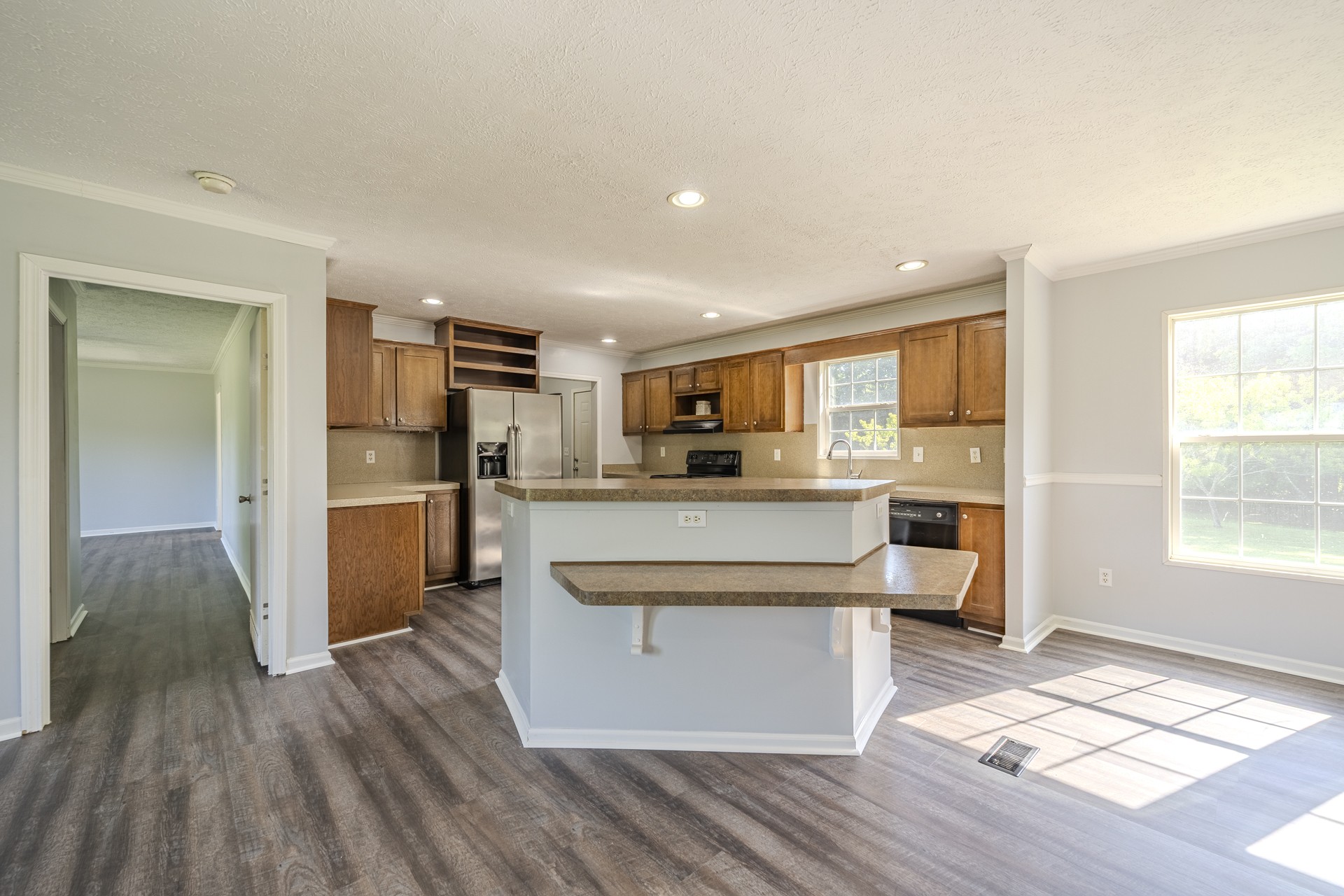 1125 Clifft Road Bolivar, TN 38008 - Photo 11 of 78 a large kitchen with stainless steel appliances kitchen island granite countertop a large window and a refrigerator
