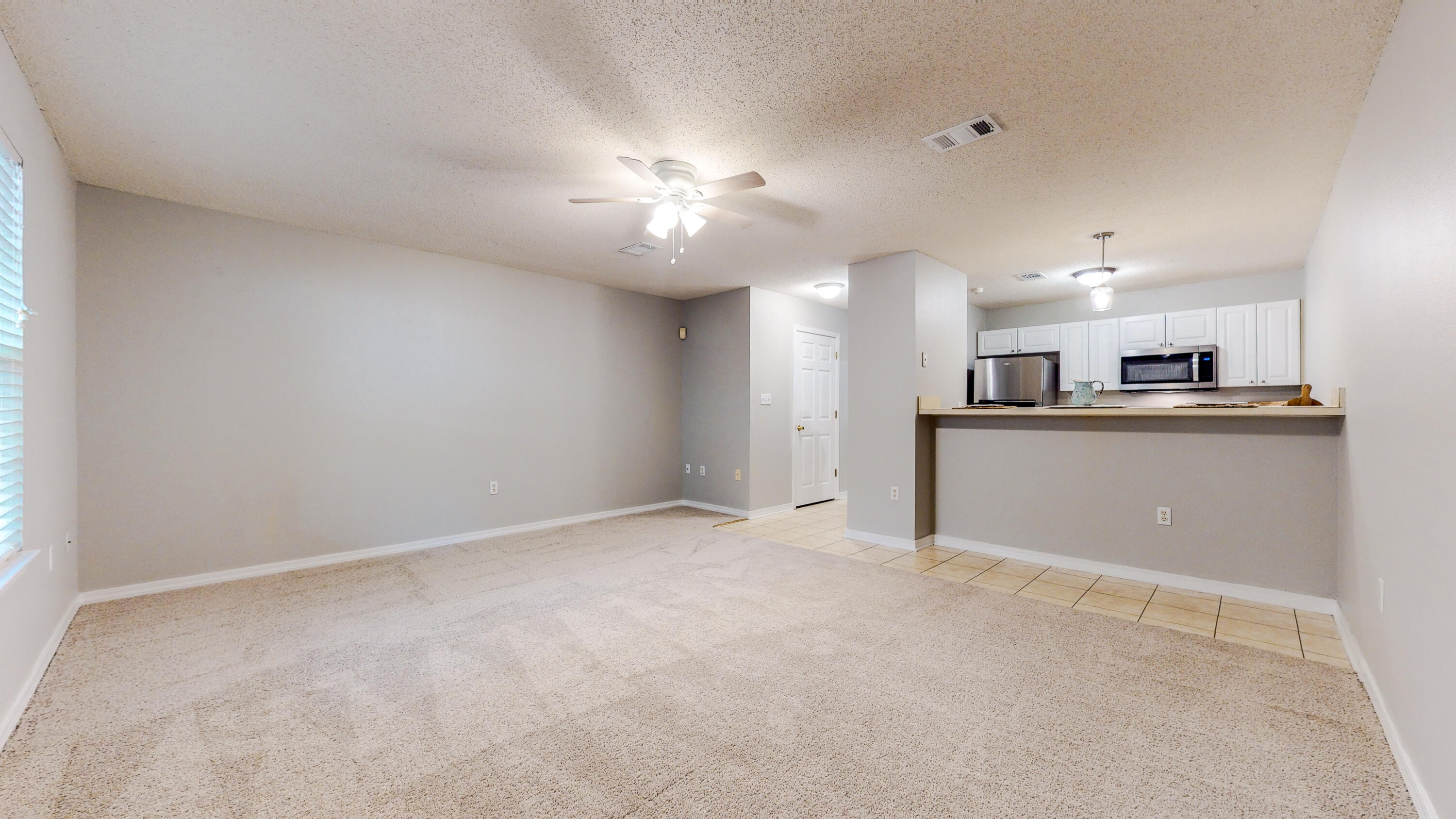 472 Keystone Road Mary Esther, FL 32569 - Photo 11 of 26 a view of a kitchen with a sink and a refrigerator