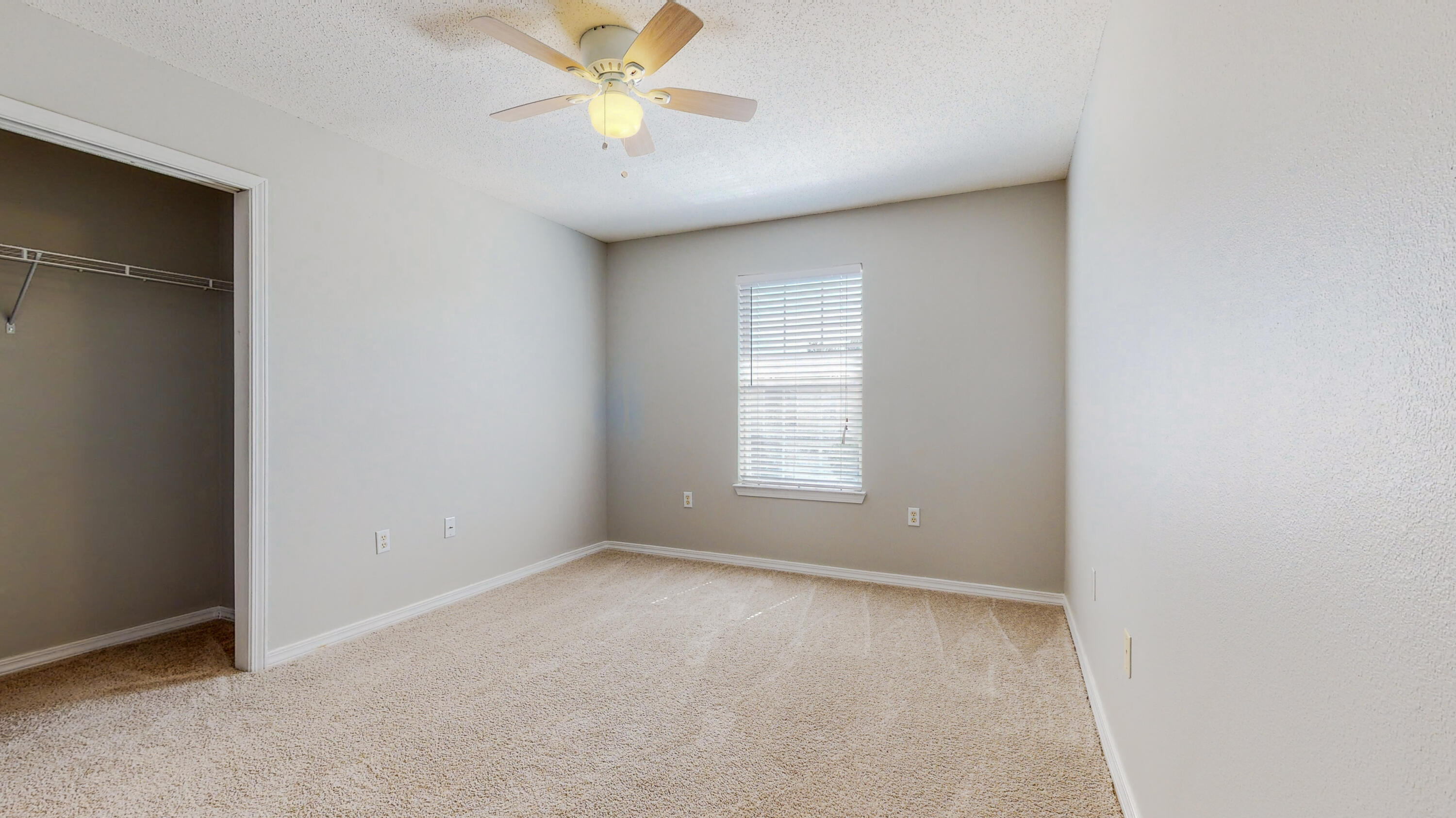 472 Keystone Road Mary Esther, FL 32569 - Photo 17 of 26 an empty room with a window and a fan