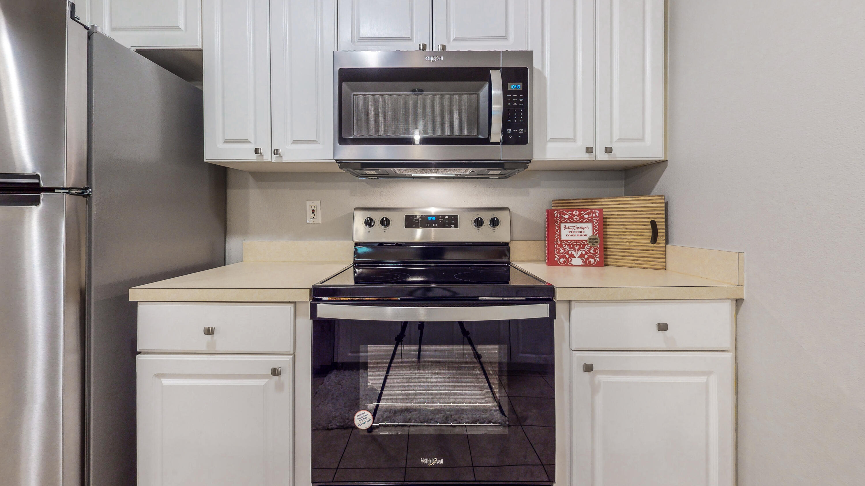 472 Keystone Road Mary Esther, FL 32569 - Photo 3 of 26 a kitchen with stainless steel appliances granite countertop a stove and a microwave