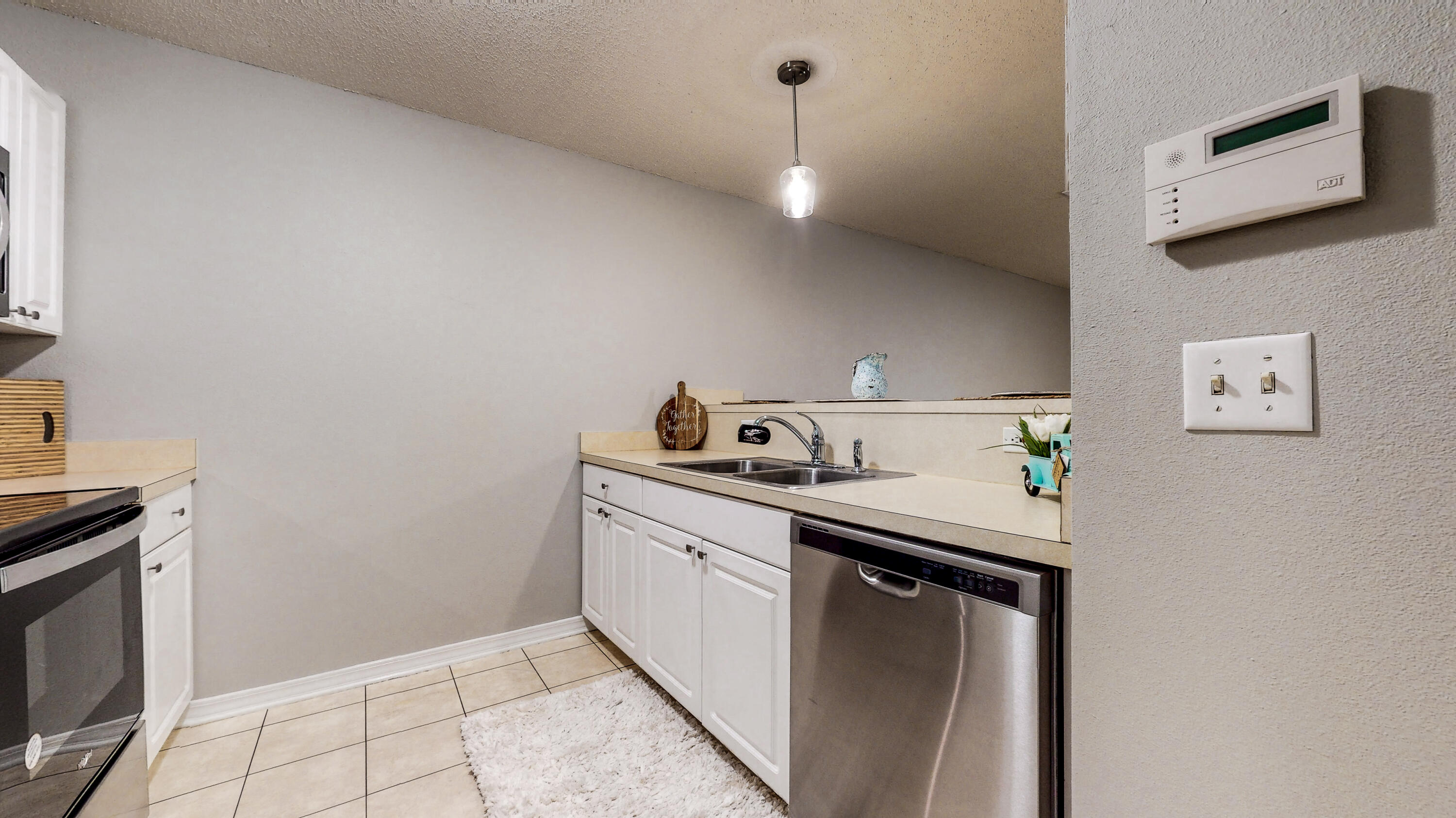 472 Keystone Road Mary Esther, FL 32569 - Photo 4 of 26 a kitchen with a sink cabinets and stainless steel appliances