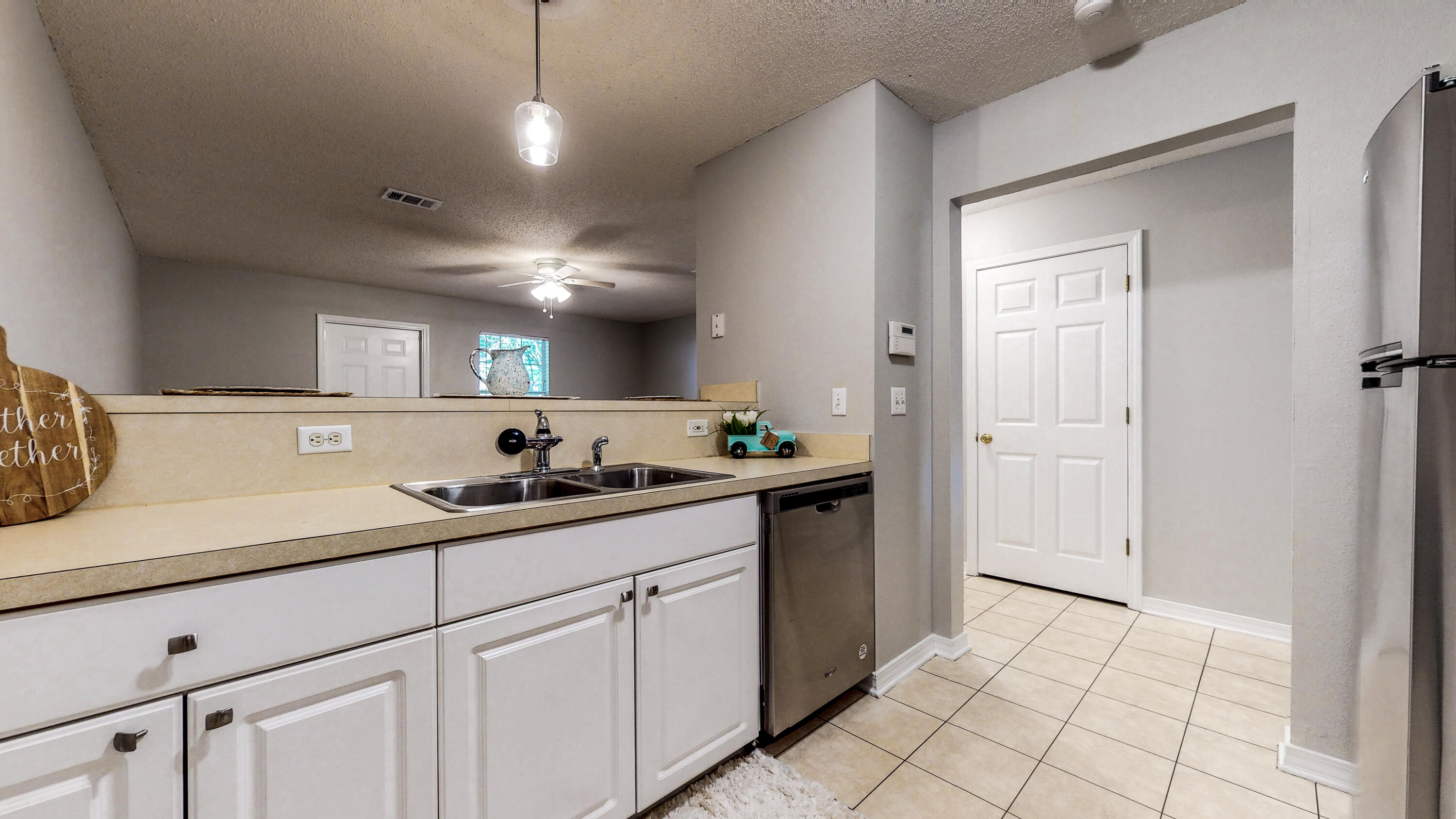 472 Keystone Road Mary Esther, FL 32569 - Photo 5 of 26 a kitchen with a sink and cabinets