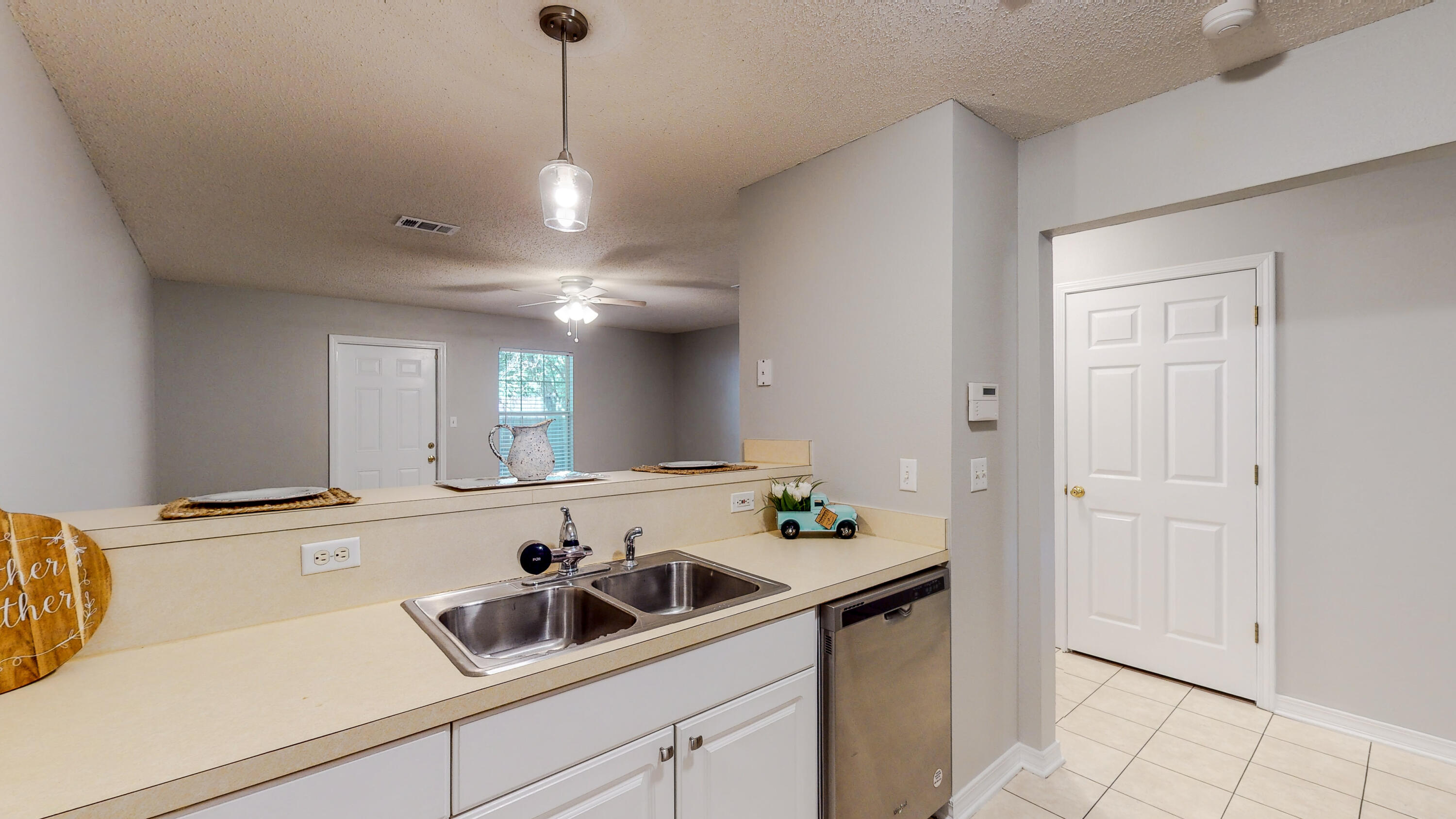 472 Keystone Road Mary Esther, FL 32569 - Photo 8 of 26 a kitchen with a sink and cabinets