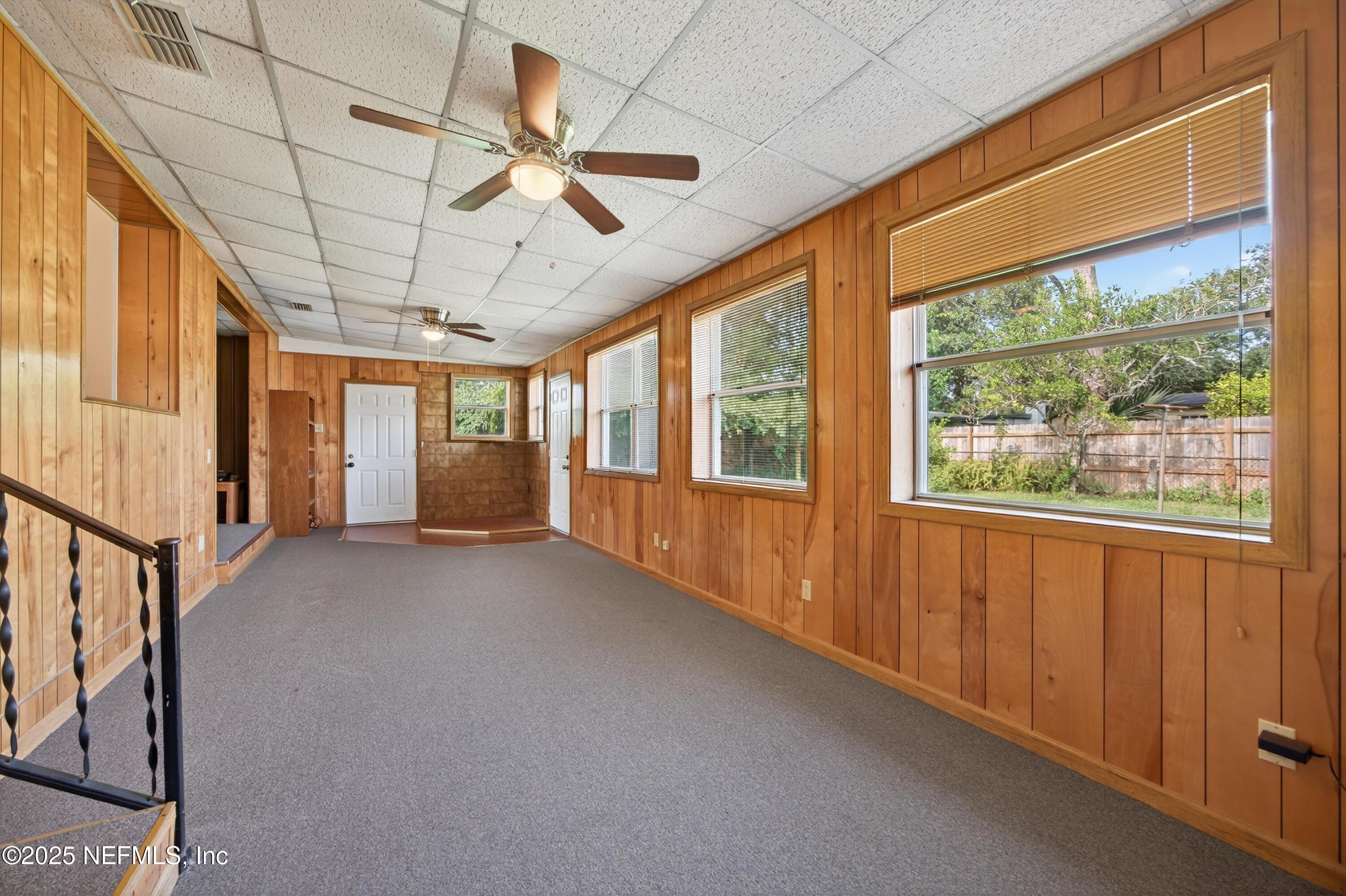 2630 Bywood Road Jacksonville, FL 32211 - Photo 13 of 35 a view of hallway with a window and chandelier