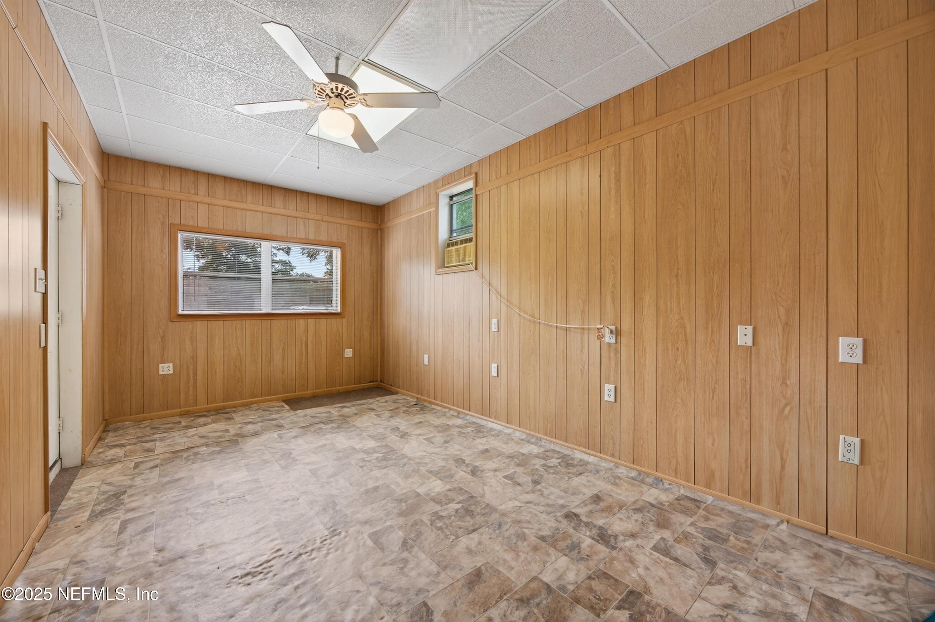 2630 Bywood Road Jacksonville, FL 32211 - Photo 18 of 35 an empty room with windows and fan