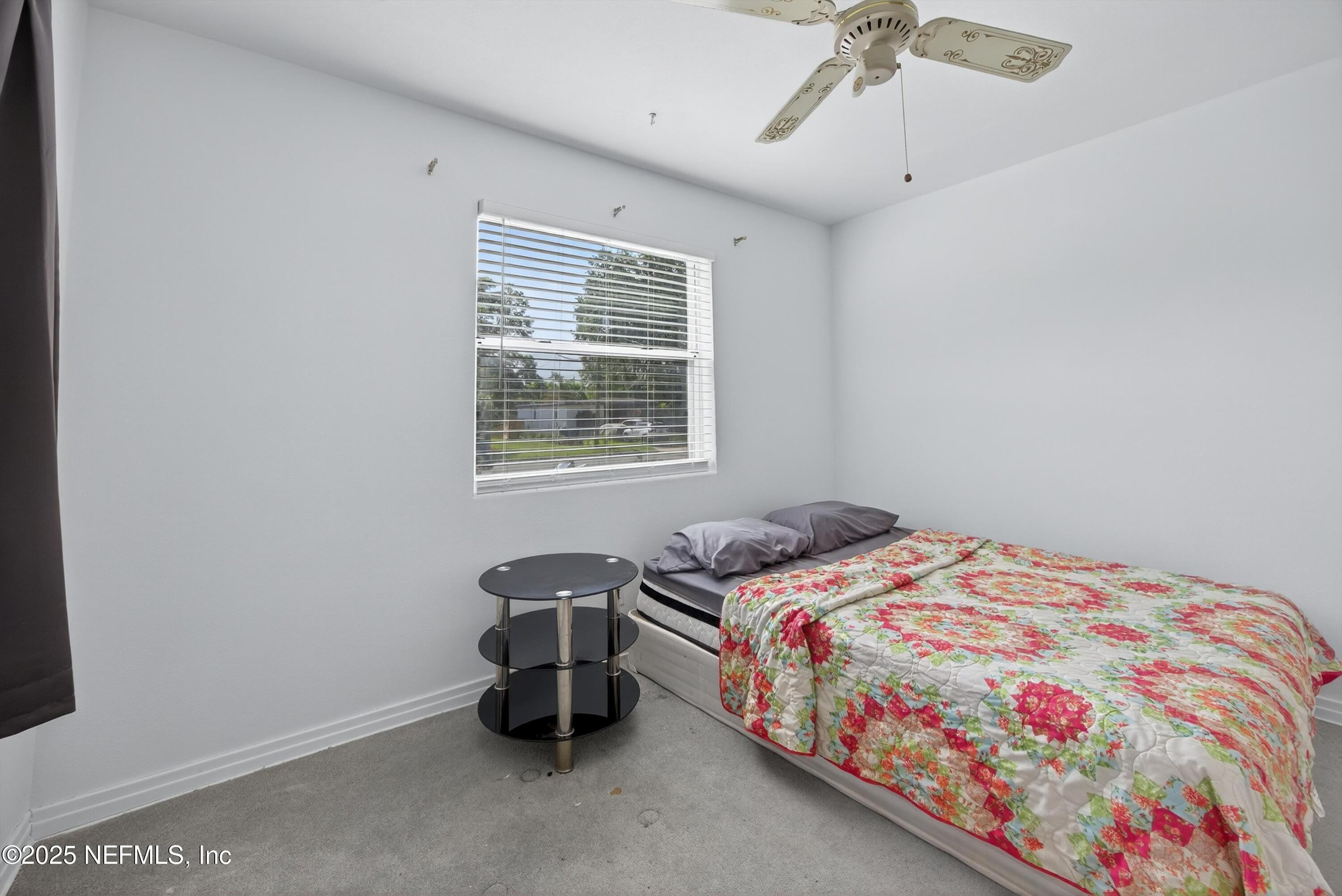 2630 Bywood Road Jacksonville, FL 32211 - Photo 20 of 35 a bedroom with a bed and a window