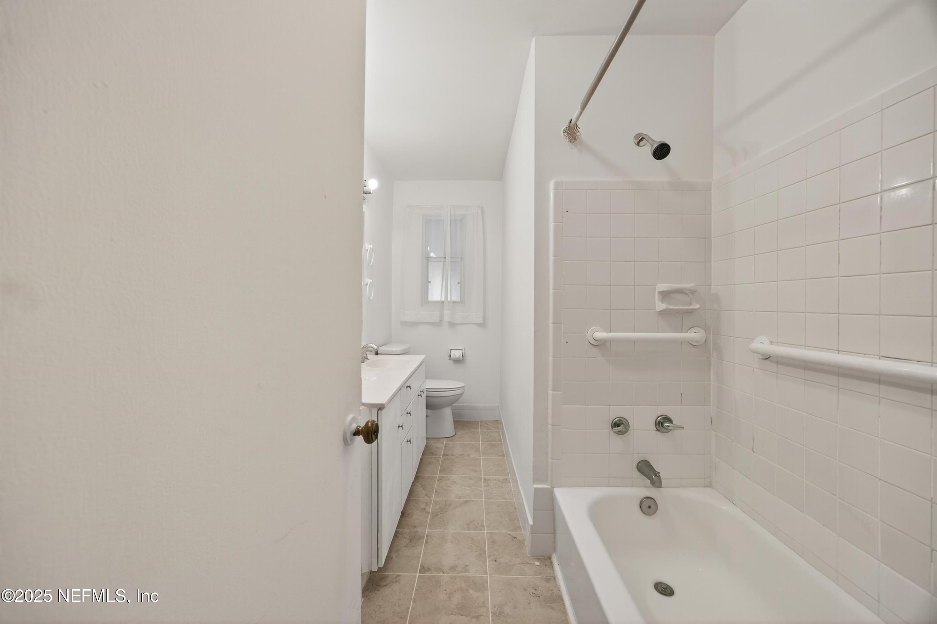 2630 Bywood Road Jacksonville, FL 32211 - Photo 22 of 35 a bathroom with a bathtub and shower