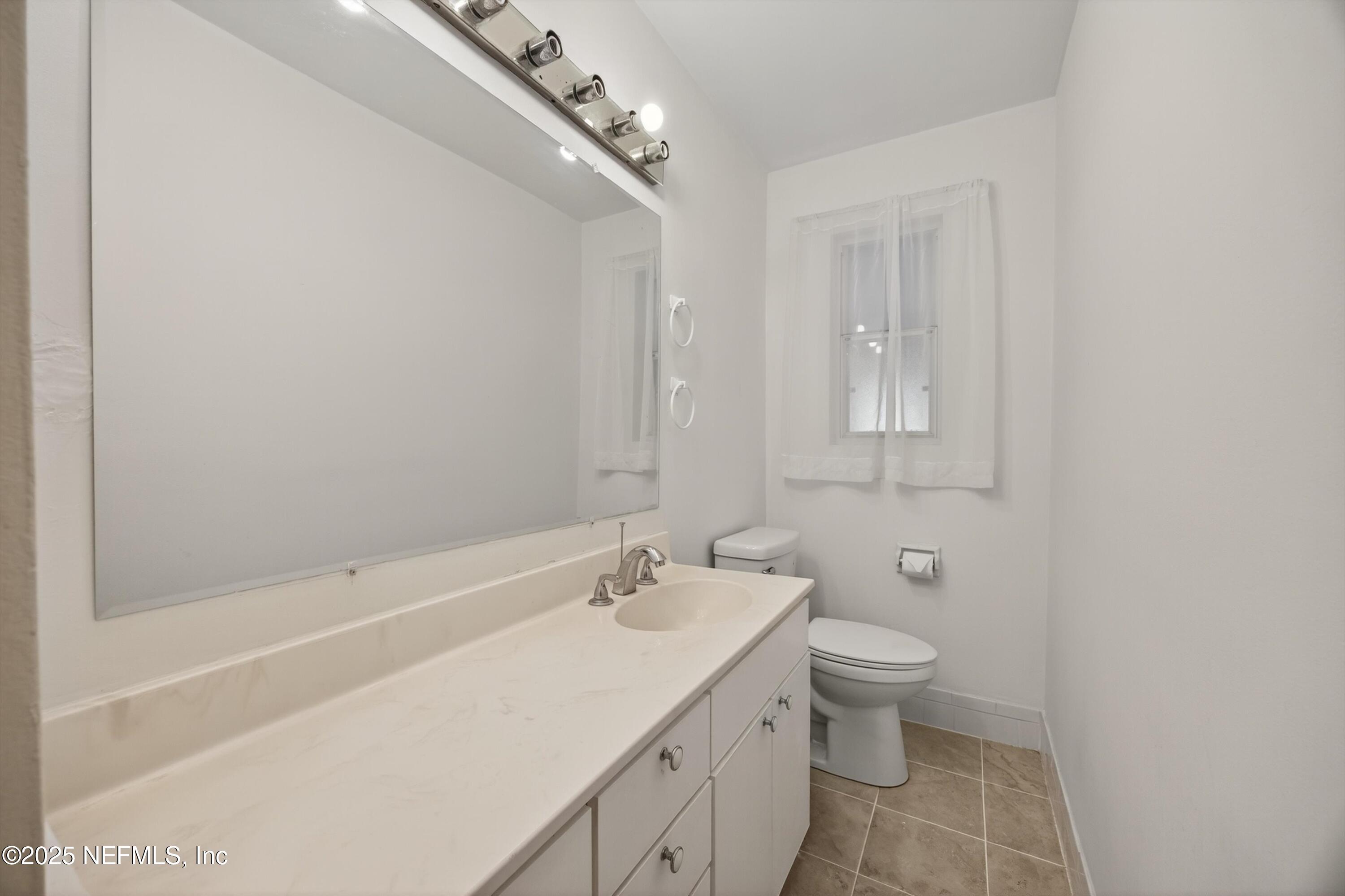 2630 Bywood Road Jacksonville, FL 32211 - Photo 23 of 35 a bathroom with a sink a toilet and shower