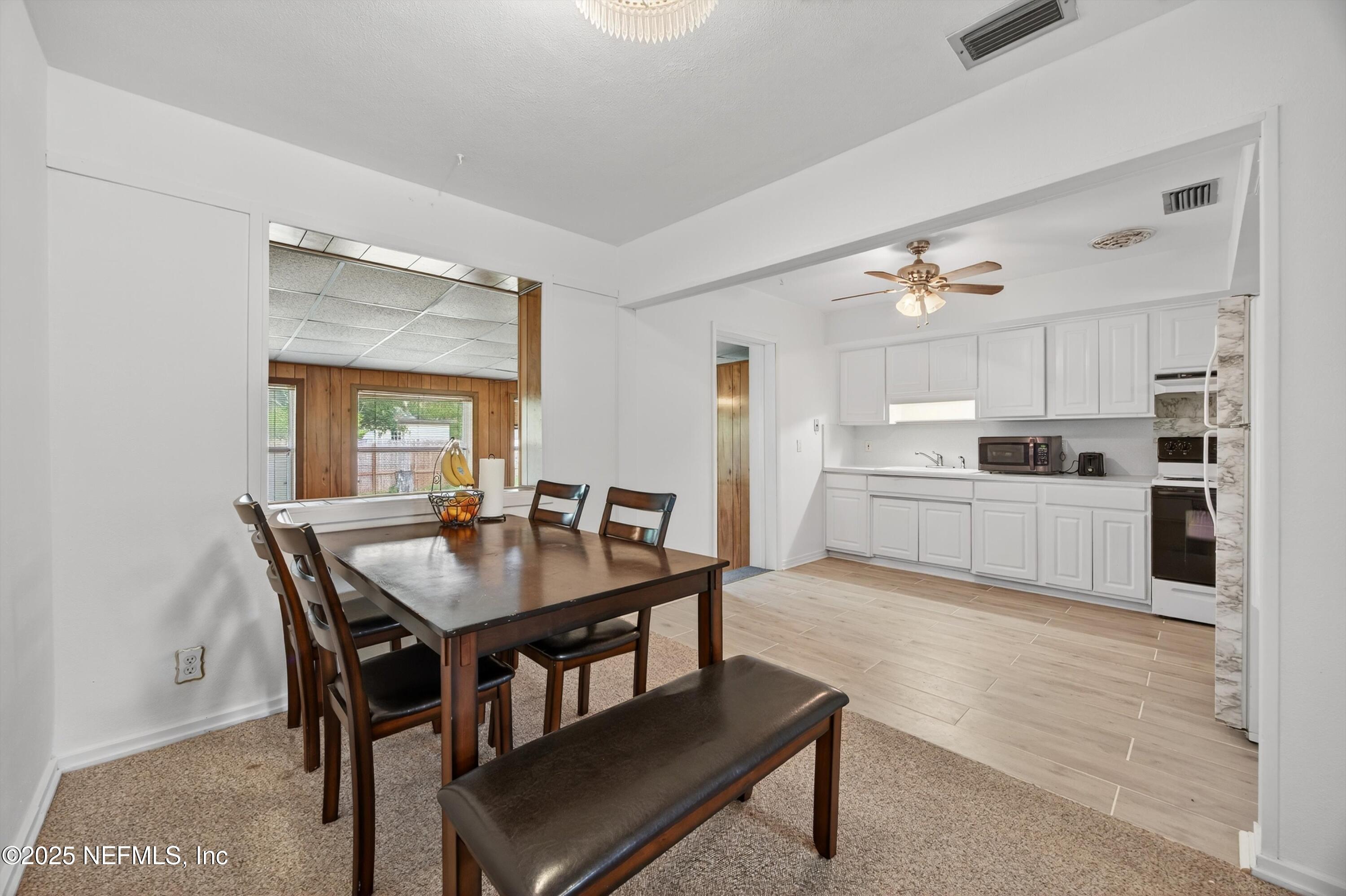 2630 Bywood Road Jacksonville, FL 32211 - Photo 8 of 35 a kitchen with a table and chairs in it