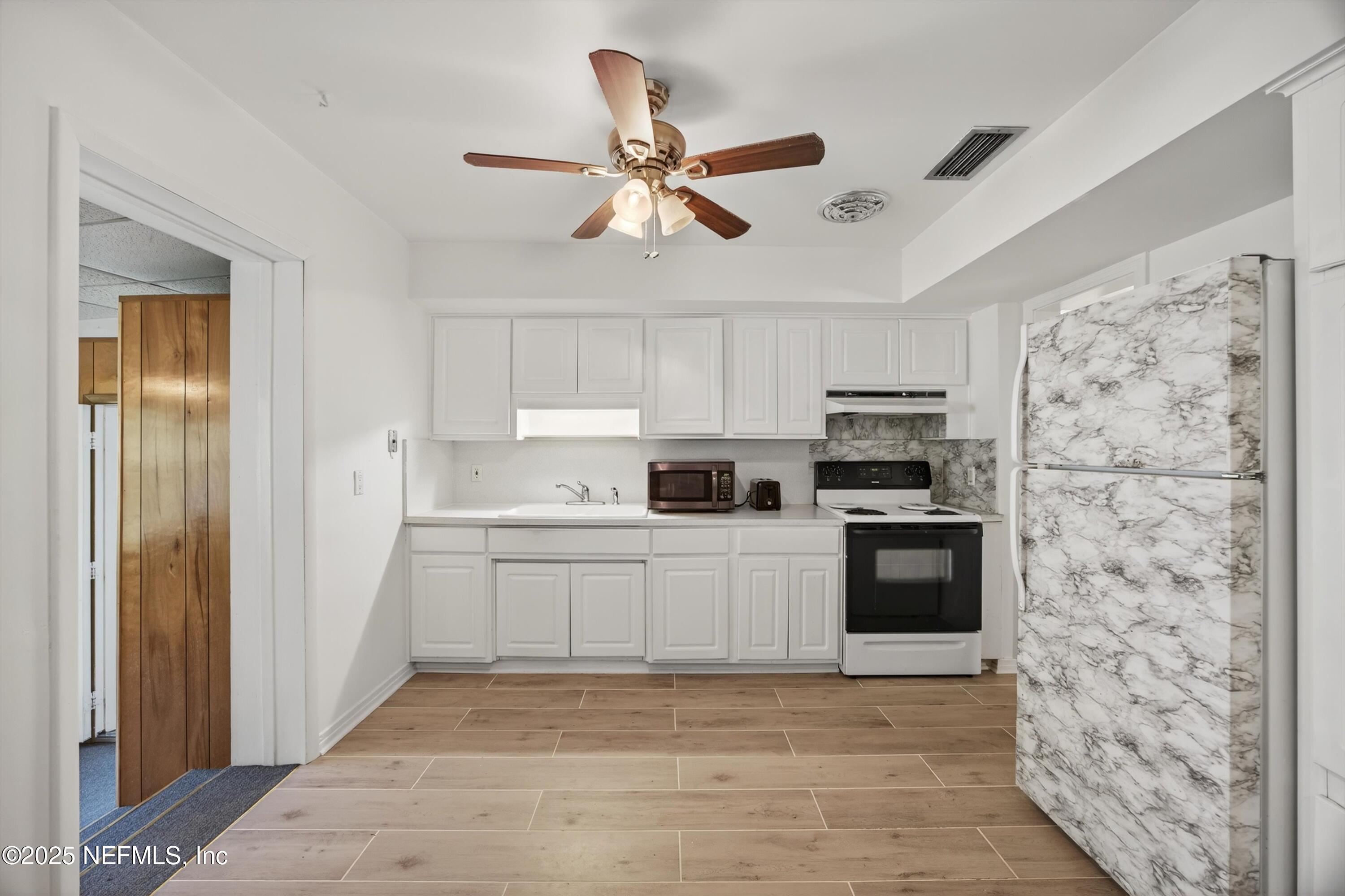 2630 Bywood Road Jacksonville, FL 32211 - Photo 9 of 35 a kitchen with stainless steel appliances a refrigerator a stove top oven a sink and dishwasher