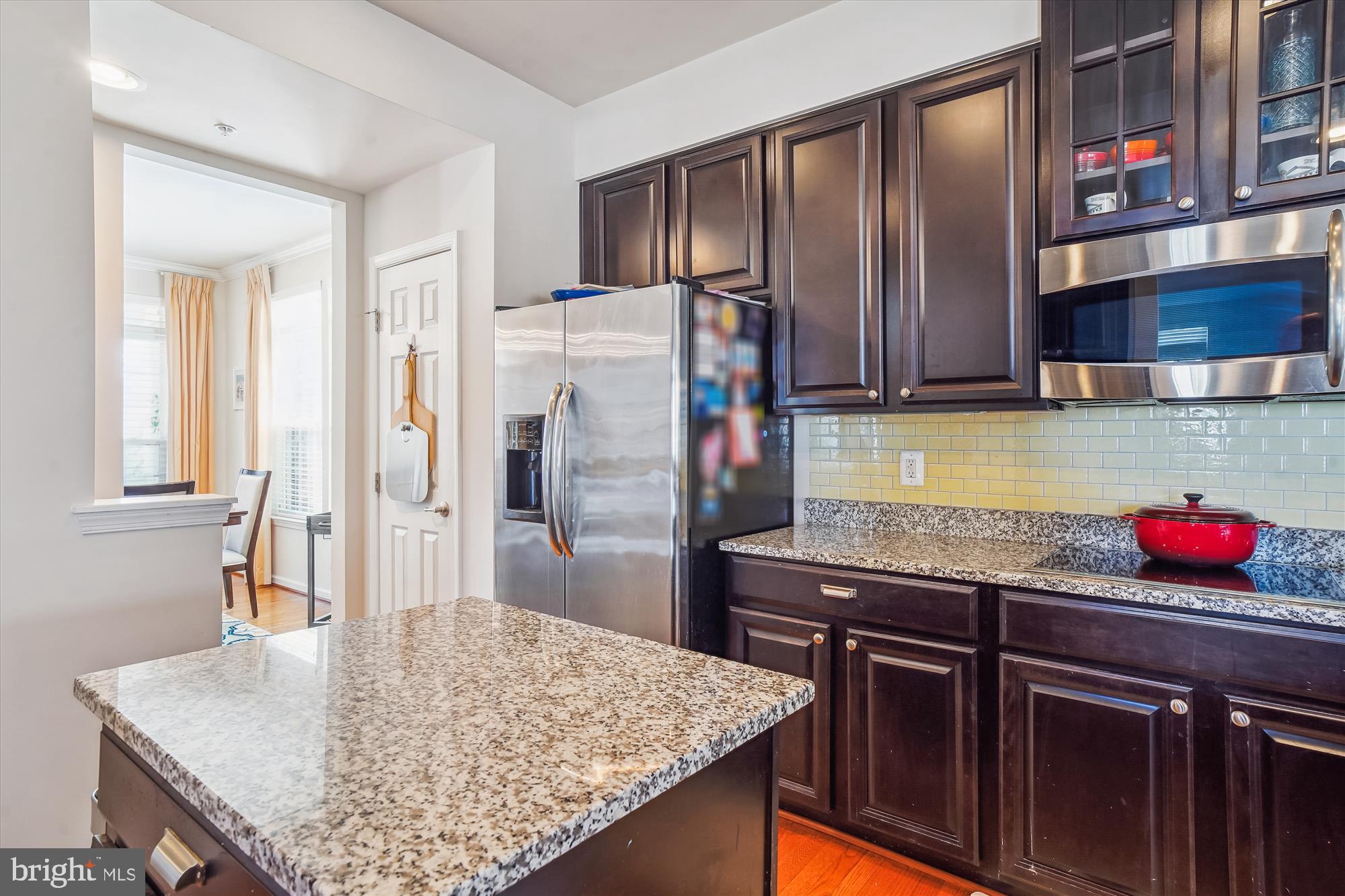11903 Deer Spring Way Clarksburg, MD 20871 - Photo 17 of 88 a kitchen with stainless steel appliances granite countertop a sink refrigerator and cabinets
