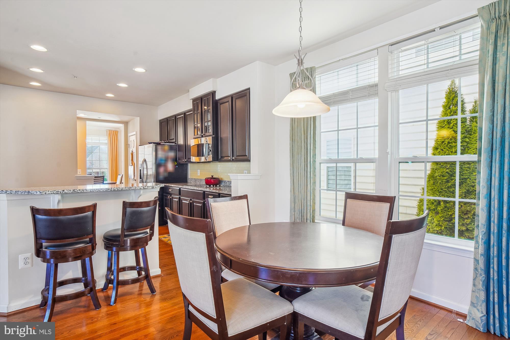 11903 Deer Spring Way Clarksburg, MD 20871 - Photo 19 of 88 a view of a dining room with furniture window and outside view