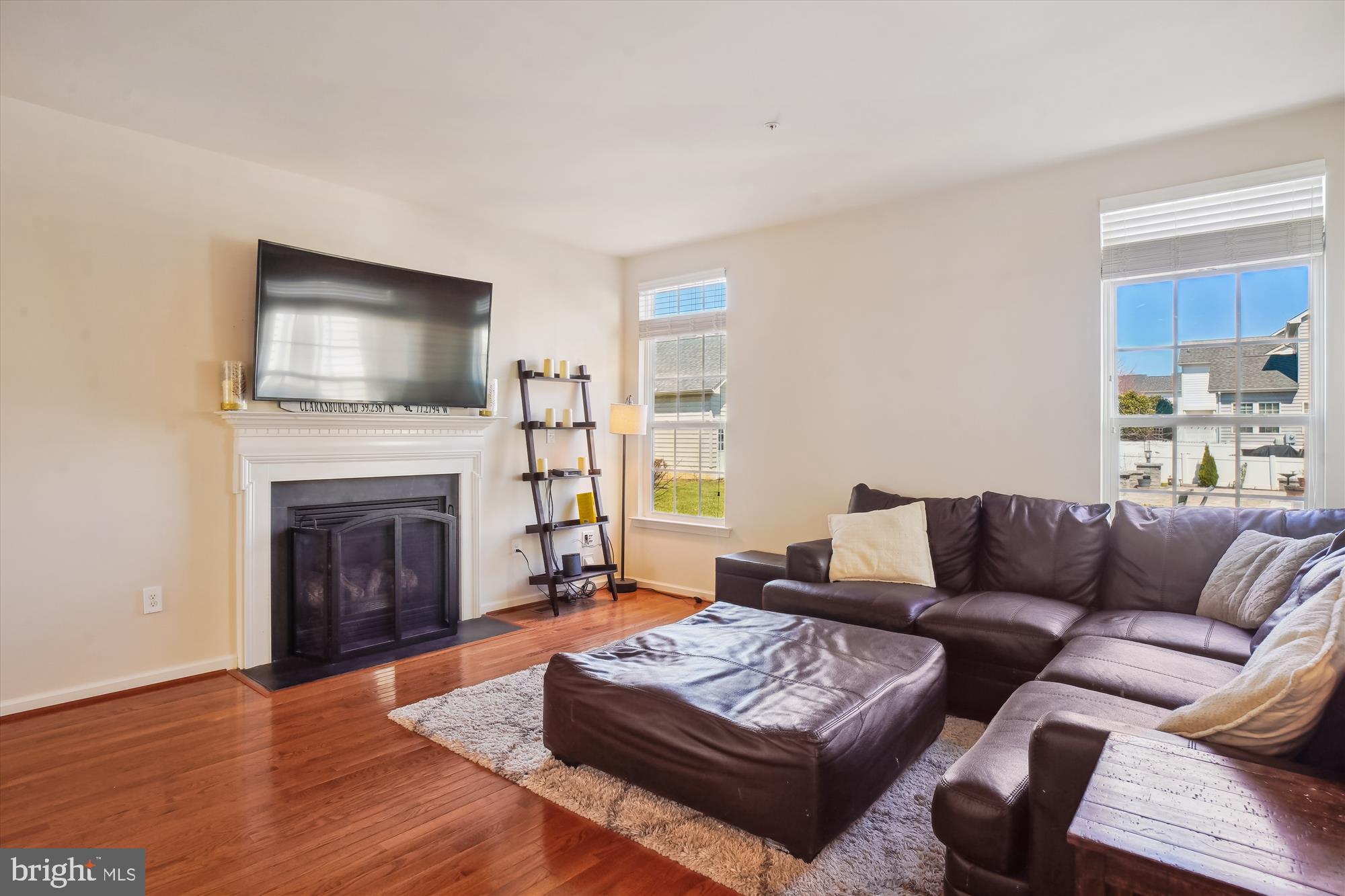 11903 Deer Spring Way Clarksburg, MD 20871 - Photo 22 of 88 a living room with furniture and a fireplace