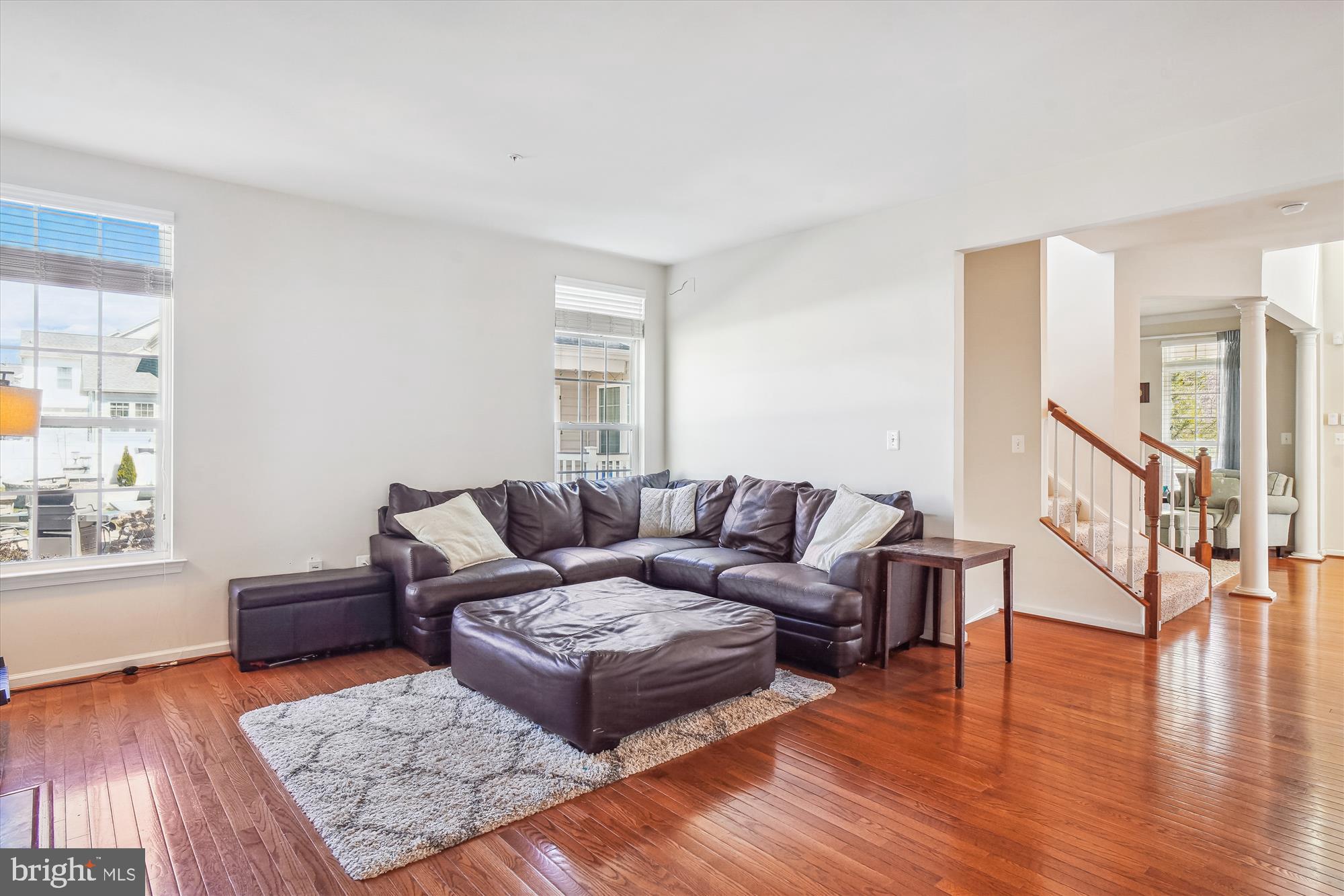 11903 Deer Spring Way Clarksburg, MD 20871 - Photo 23 of 88 a living room with furniture and a wooden floor