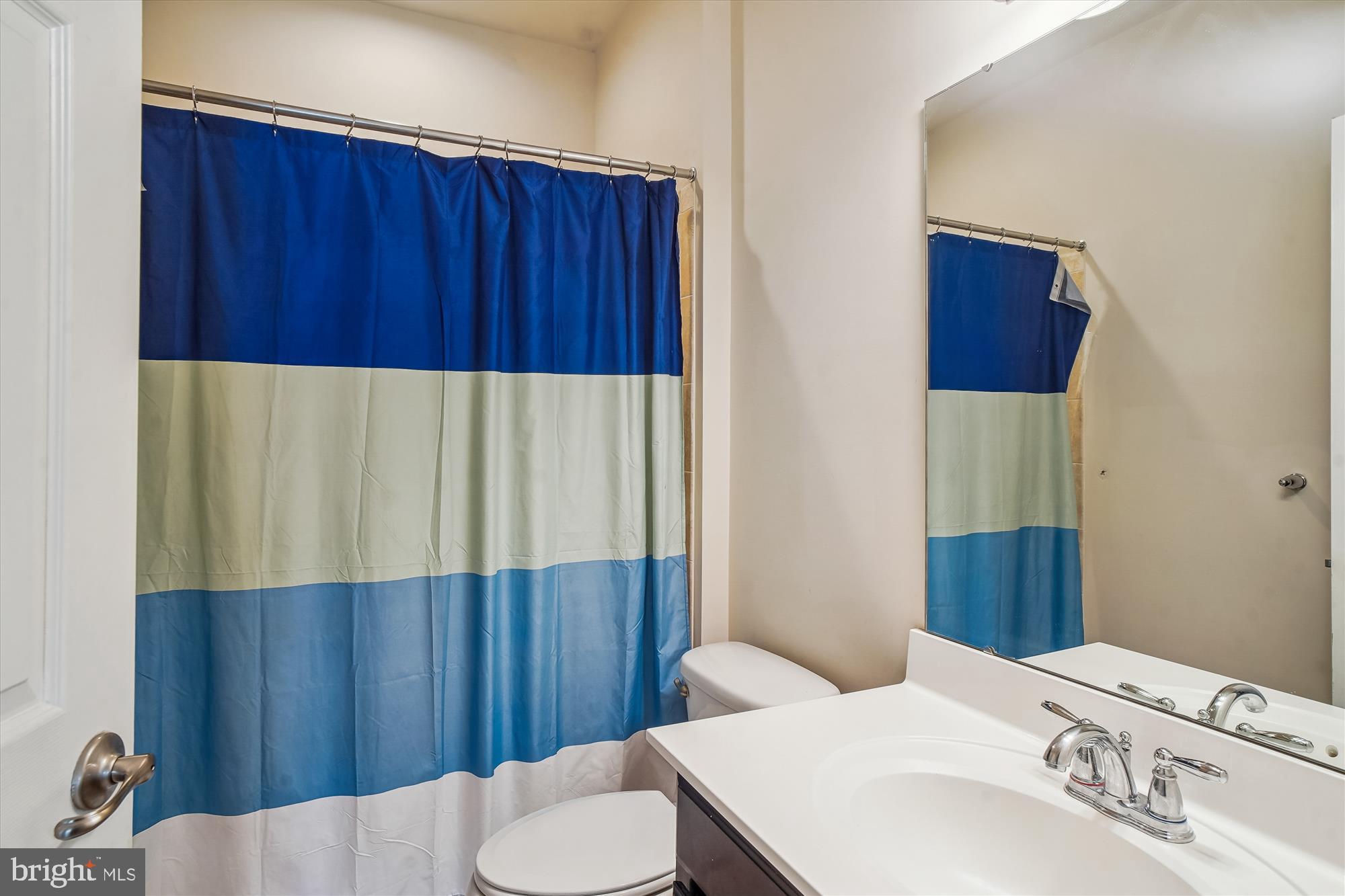 11903 Deer Spring Way Clarksburg, MD 20871 - Photo 33 of 88 a bathroom with a sink a toilet and vanity