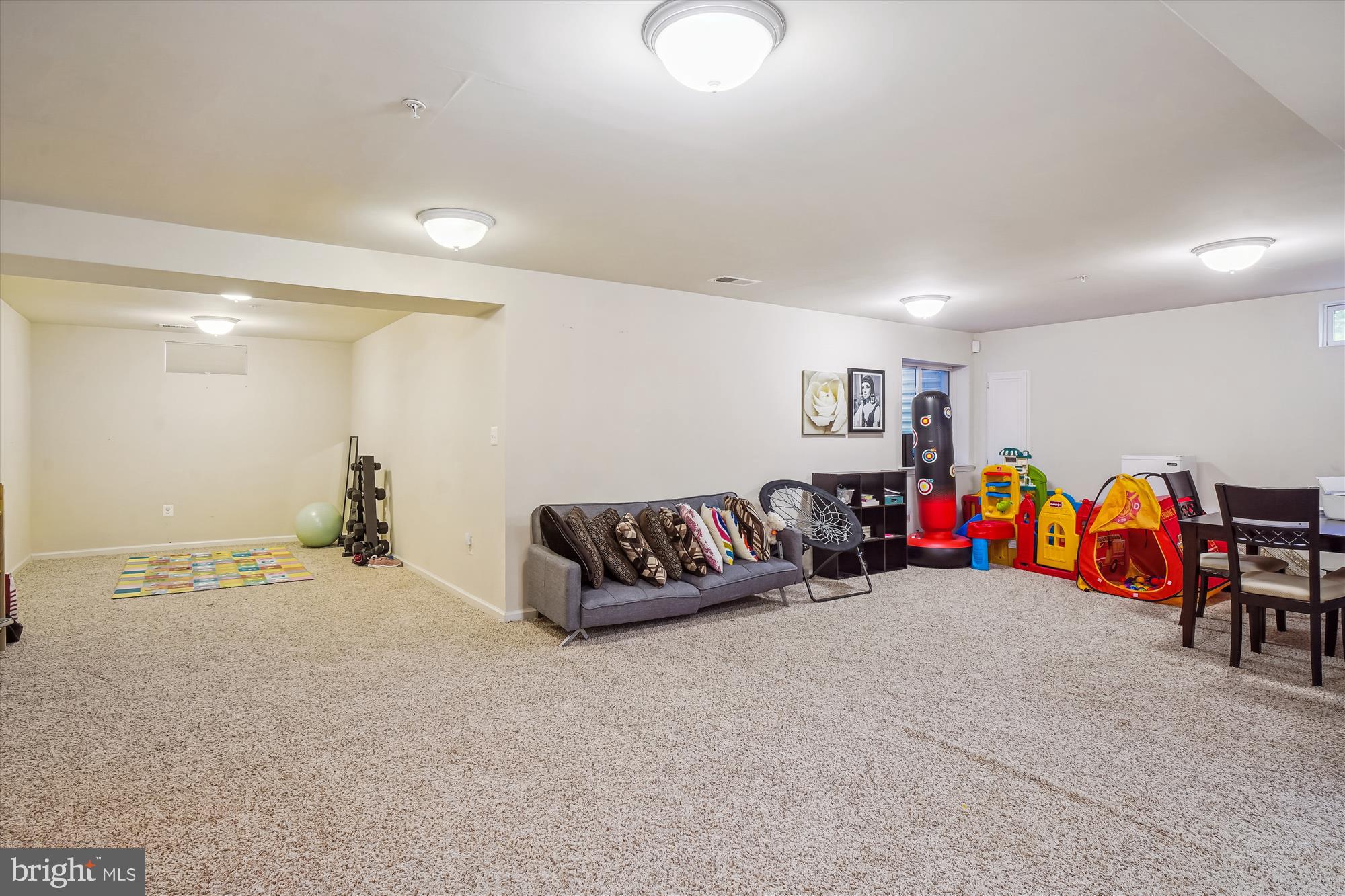 11903 Deer Spring Way Clarksburg, MD 20871 - Photo 47 of 88 a living room with furniture and white walls
