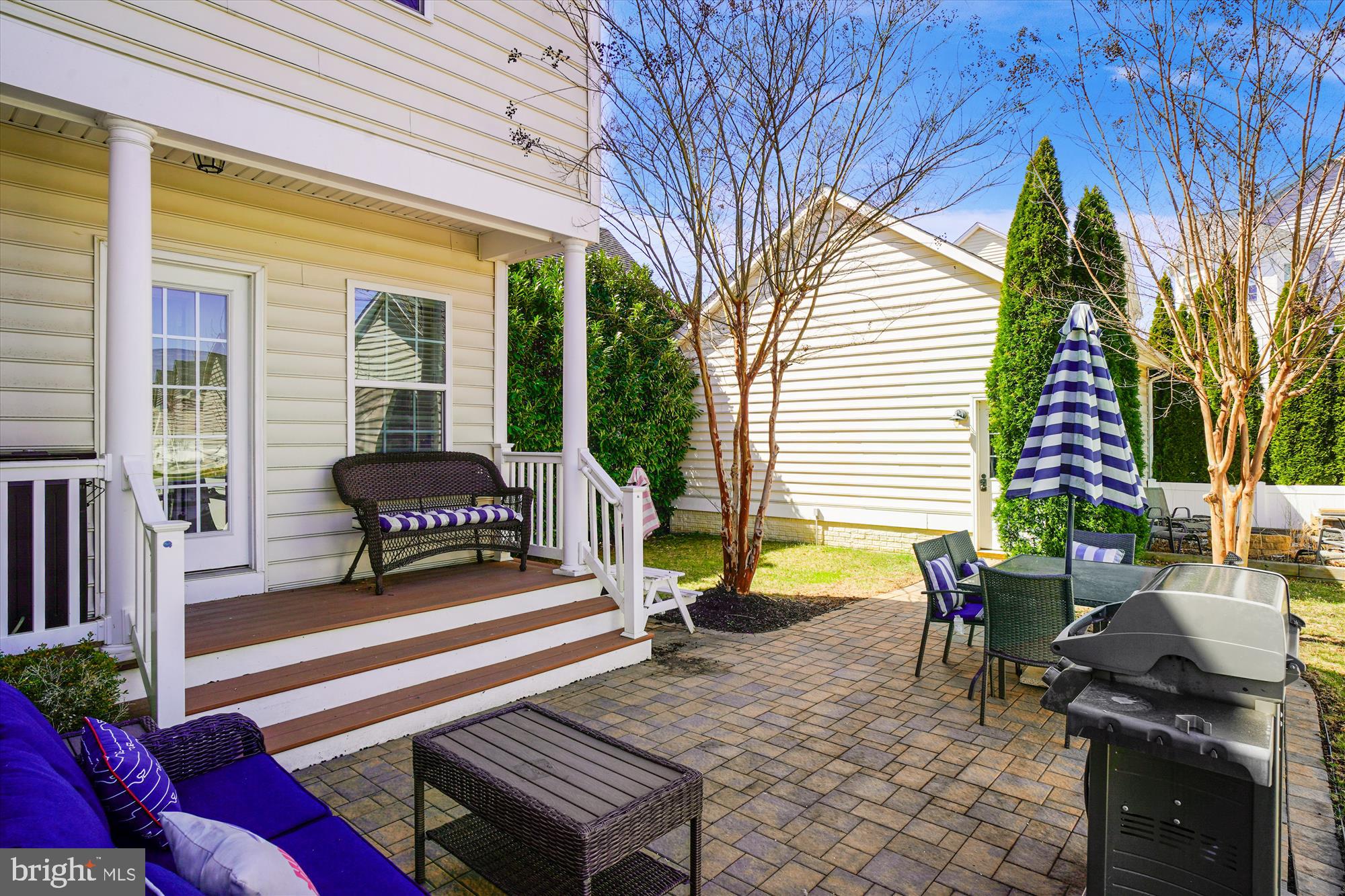 11903 Deer Spring Way Clarksburg, MD 20871 - Photo 51 of 88 a view of a patio with chair and tables back yard of the house