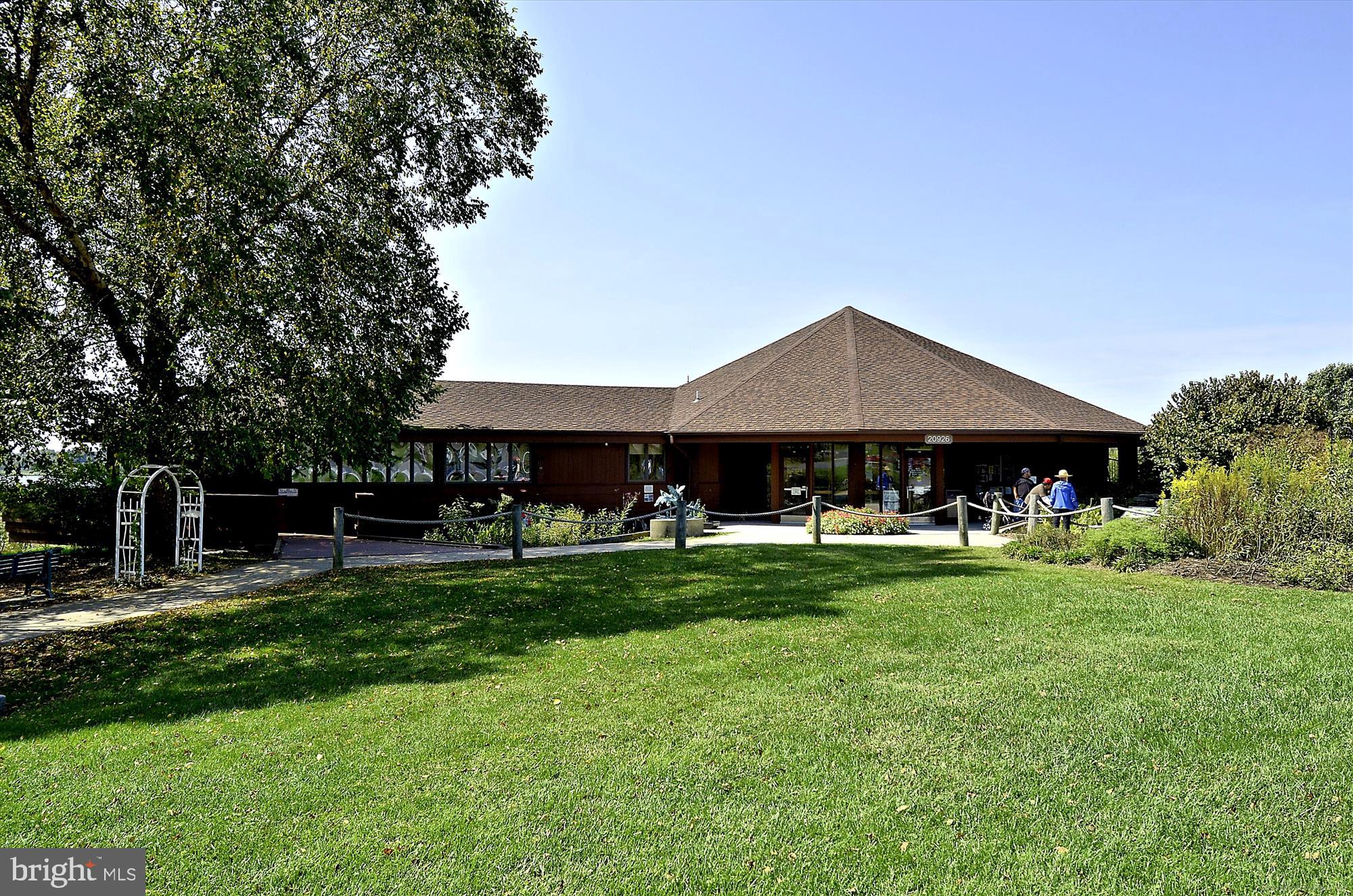 11903 Deer Spring Way Clarksburg, MD 20871 - Photo 76 of 88 a front view of house with a garden and trees