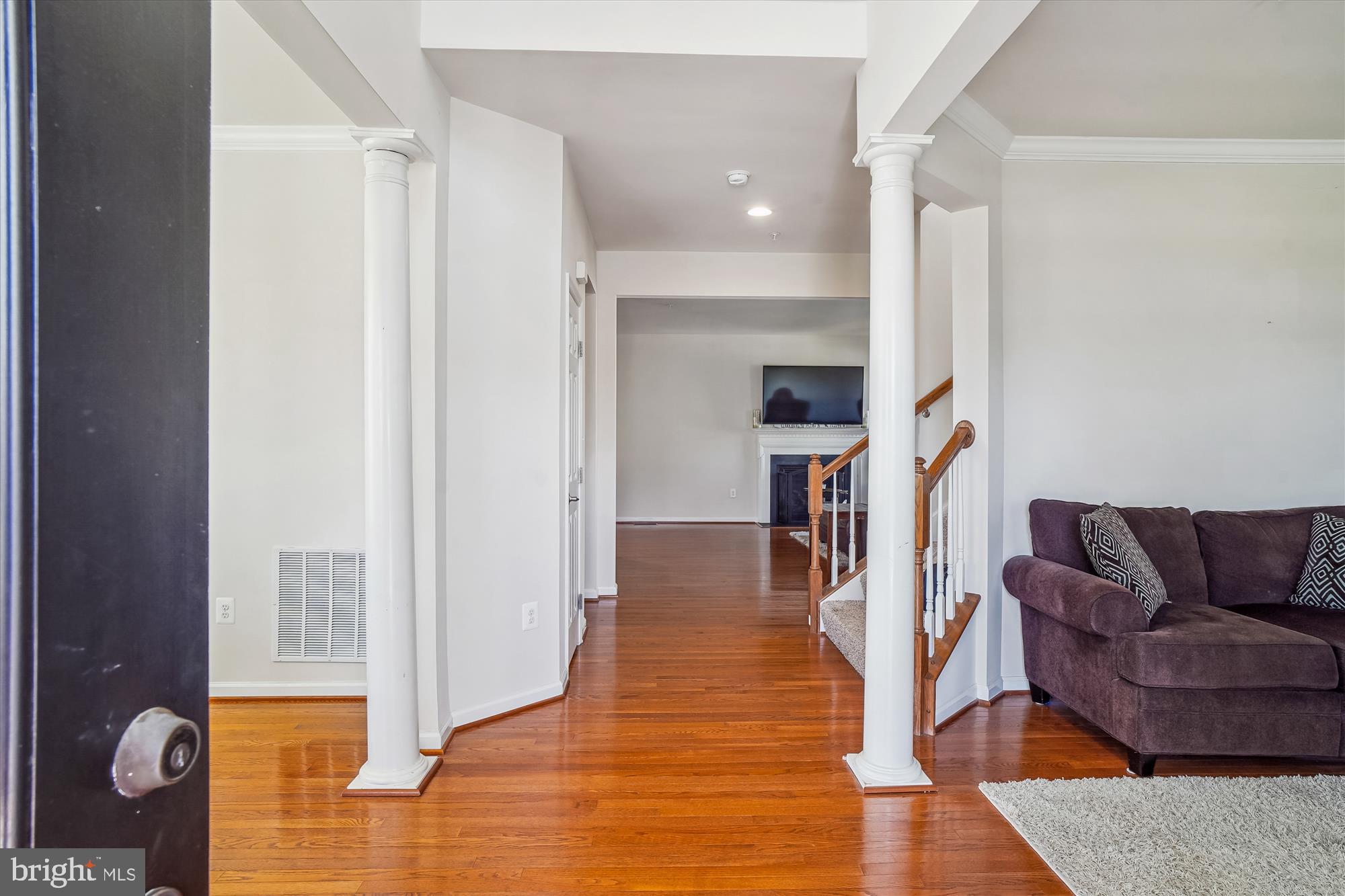 11903 Deer Spring Way Clarksburg, MD 20871 - Photo 8 of 88 a living room with furniture and a wooden floor