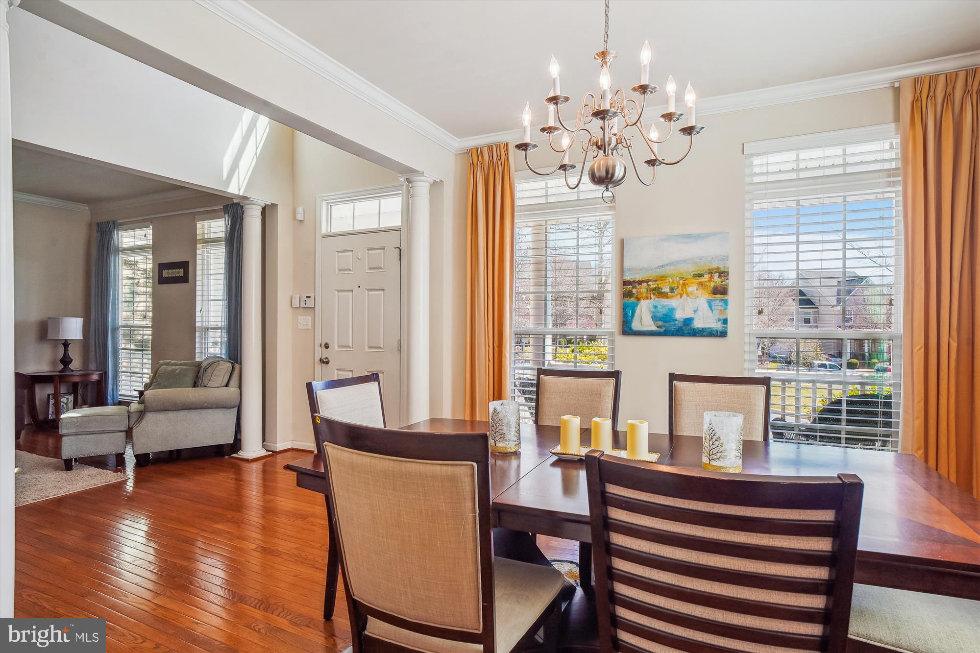 11903 Deer Spring Way Clarksburg, MD 20871 - Photo 10 of 88 a living room with patio furniture and a chandelier