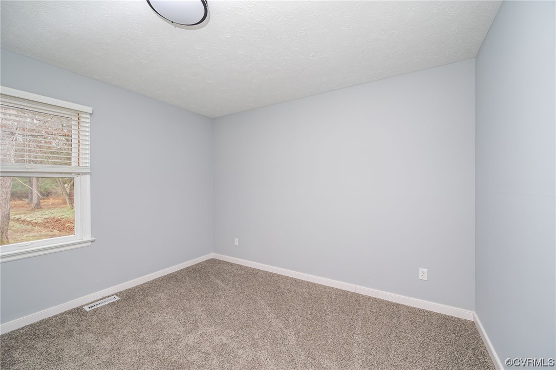 4741 Roxbury Road Charles City, VA 23030 - Photo 17 of 32 a view of an empty room with a window