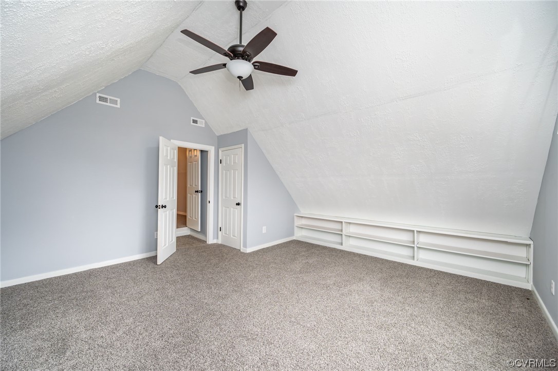 4741 Roxbury Road Charles City, VA 23030 - Photo 27 of 32 an empty room with a ceiling fan and window