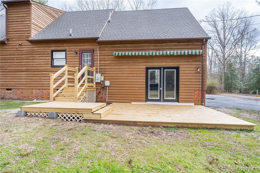 4741 Roxbury Road Charles City, VA 23030 - Photo 29 of 32 a front view of a house with a yard and garage