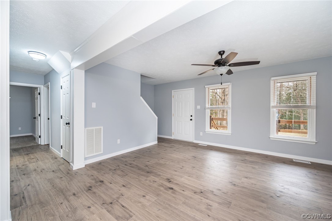4741 Roxbury Road Charles City, VA 23030 - Photo 5 of 32 a view of empty room with wooden floor and fan