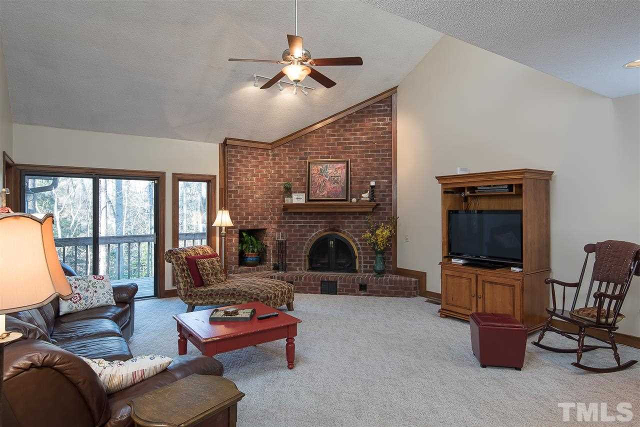 12613 Birchfalls Drive Raleigh, NC 27614 - Photo 6 of 11 Very open, sunk-in living room with access to sunroom and deck. 2nd floor LOFT overlooks living room! Living Room/ Great Room