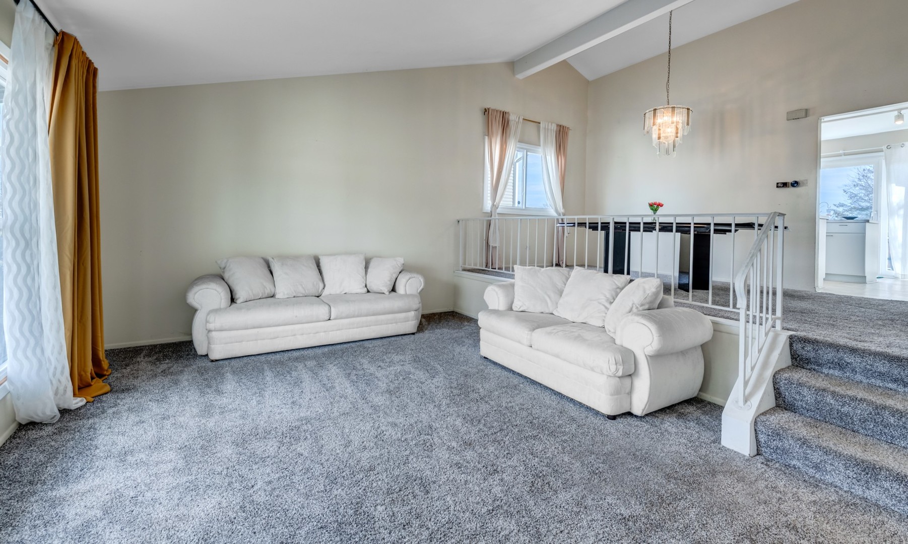 1651 West Goldengate Drive Addison, IL 60101 - Photo 4 of 24 a living room with furniture and a chandelier