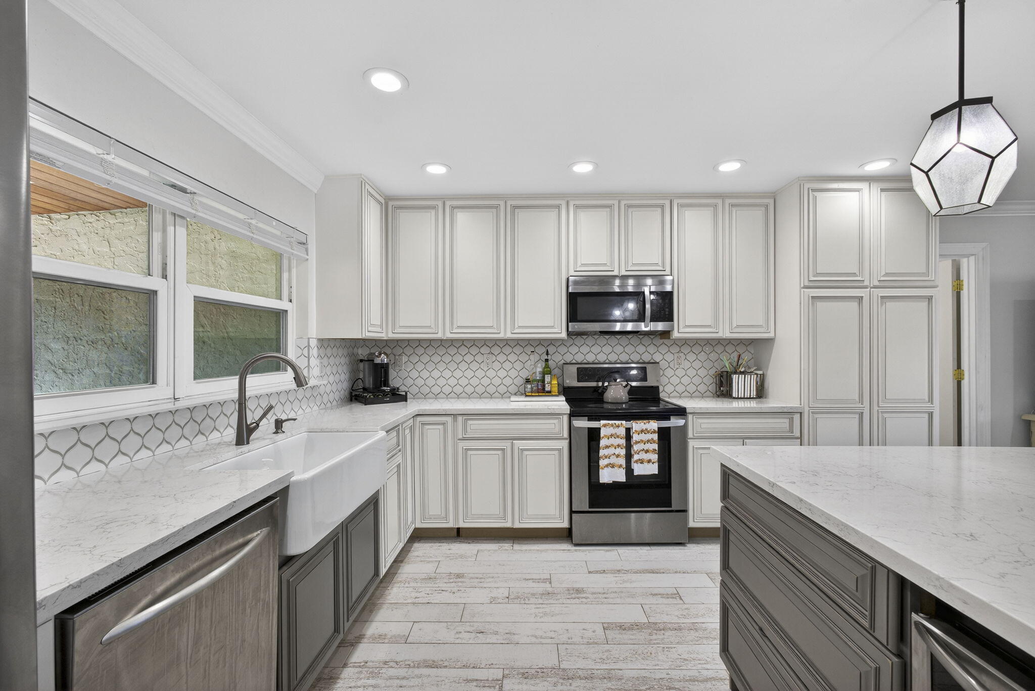 16490 Rustic Road Wellington, FL 33470 - Photo 12 of 81 a kitchen with stainless steel appliances granite countertop a sink stove and refrigerator