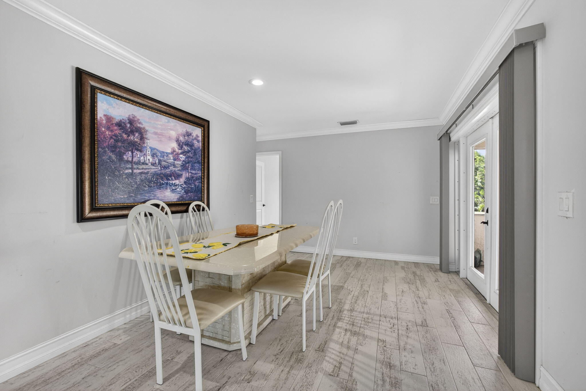 16490 Rustic Road Wellington, FL 33470 - Photo 13 of 81 a view of a dining room with furniture and wooden floor