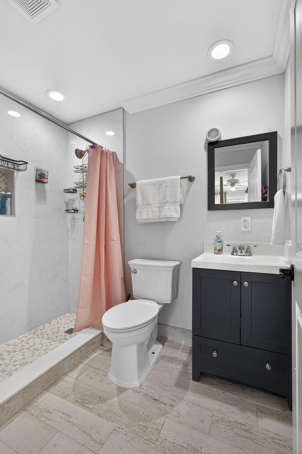 16490 Rustic Road Wellington, FL 33470 - Photo 31 of 81 a bathroom with a sink toilet and shower