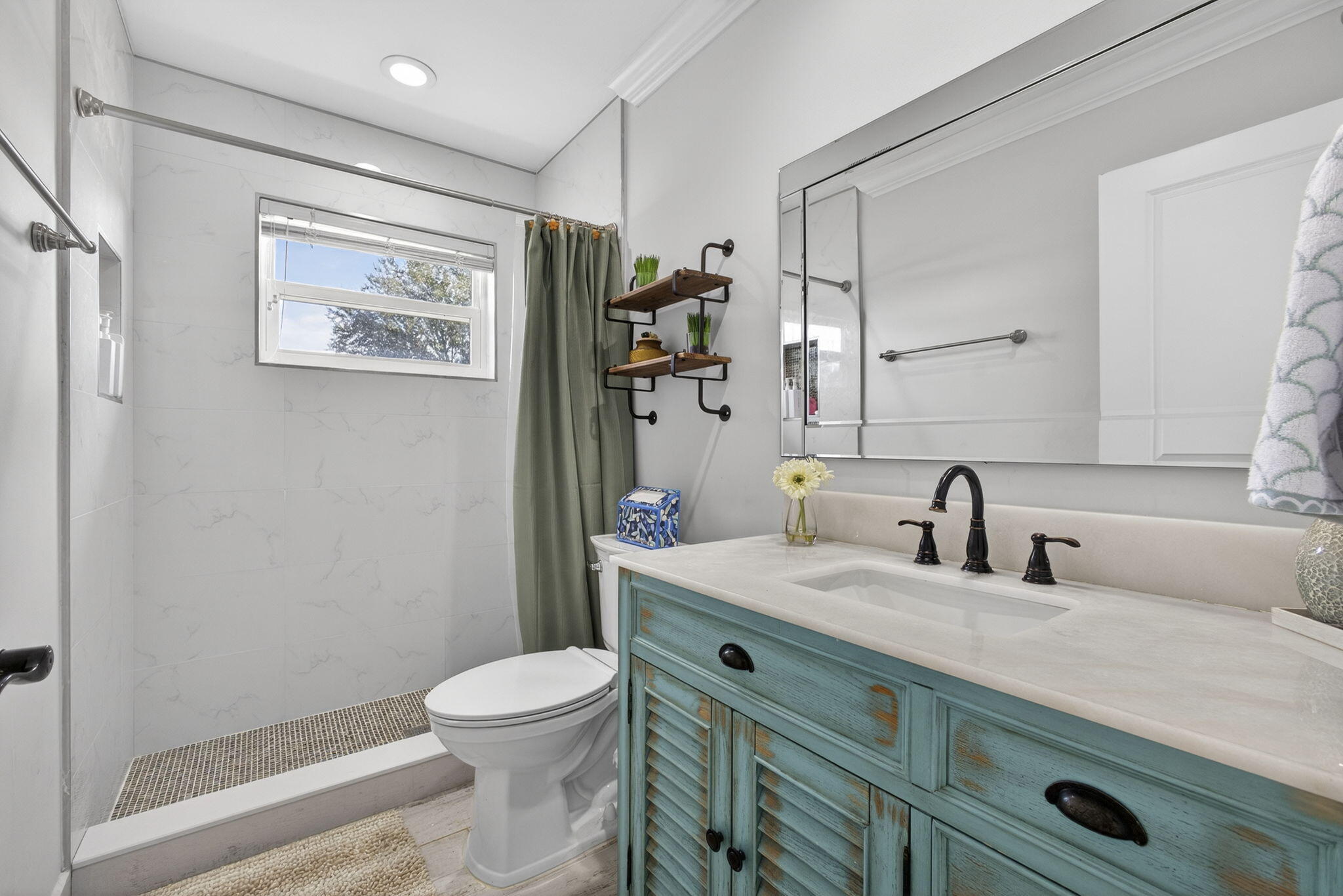 16490 Rustic Road Wellington, FL 33470 - Photo 32 of 81 a bathroom with a granite countertop toilet a sink and a mirror