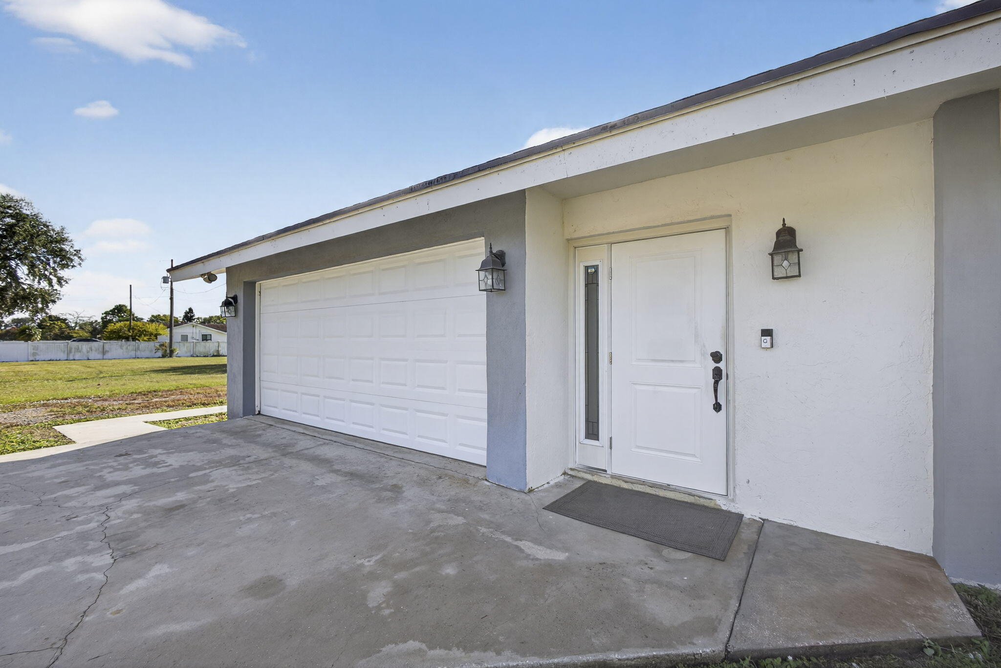 16490 Rustic Road Wellington, FL 33470 - Photo 41 of 81 a view of a house with a backyard